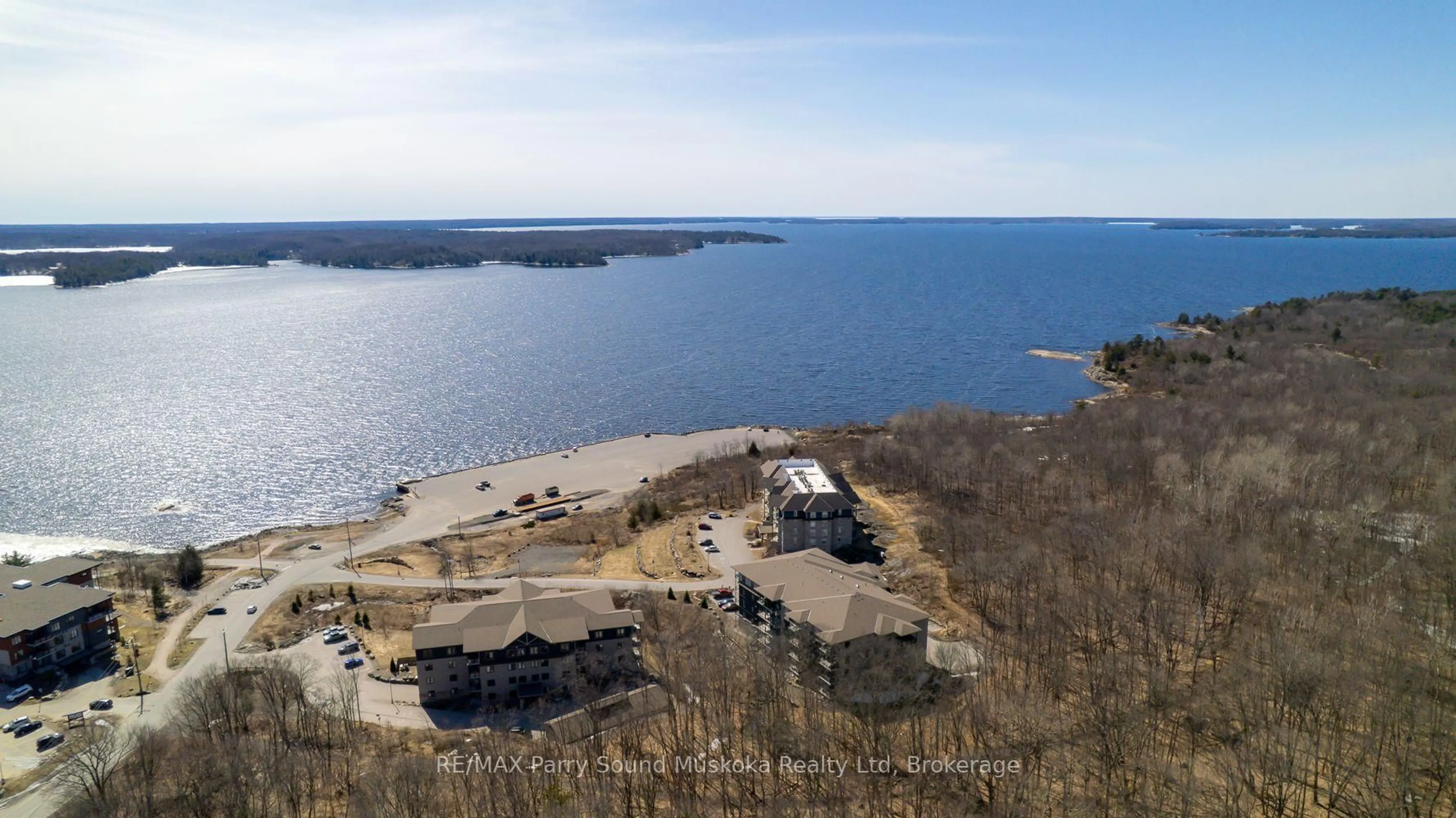 A pic from outside/outdoor area/front of a property/back of a property/a pic from drone, water/lake/river/ocean view for 11B Salt Dock Rd #401, Parry Sound Ontario P2A 3B6