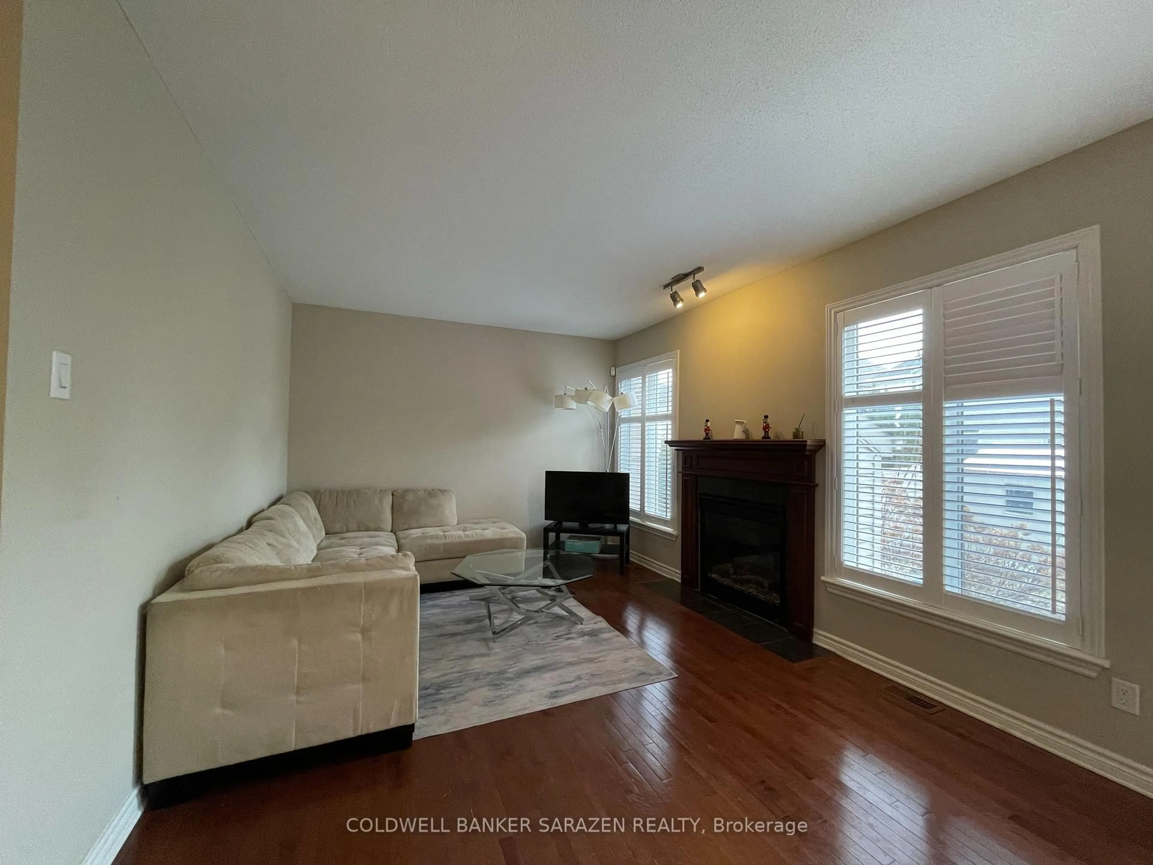 Living room with furniture, wood/laminate floor for 105 AUGUST LILY Cres, Ottawa Ontario K1V 2A6
