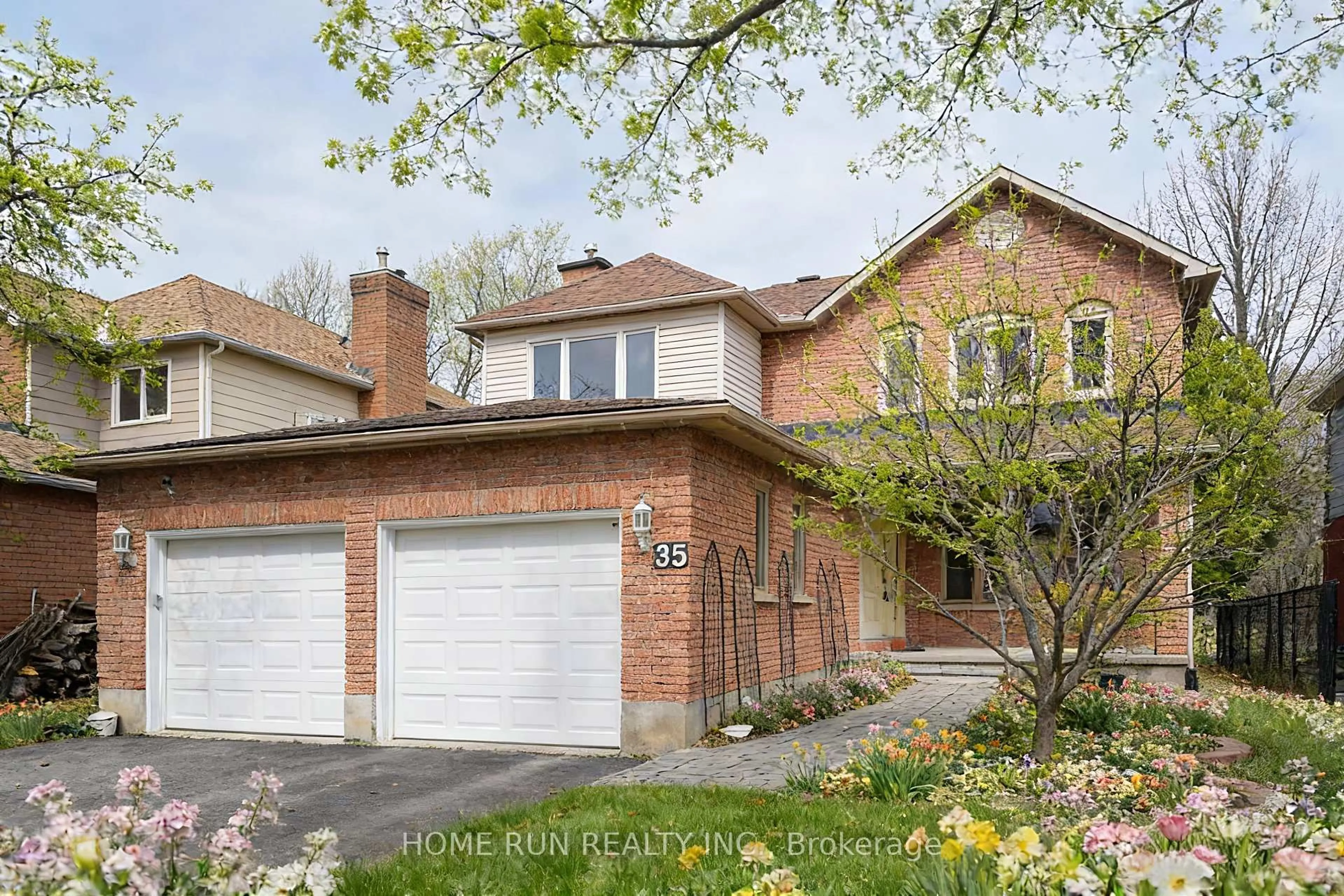 Home with brick exterior material, street for 35 Weslock Way, Ottawa Ontario K2K 2K3