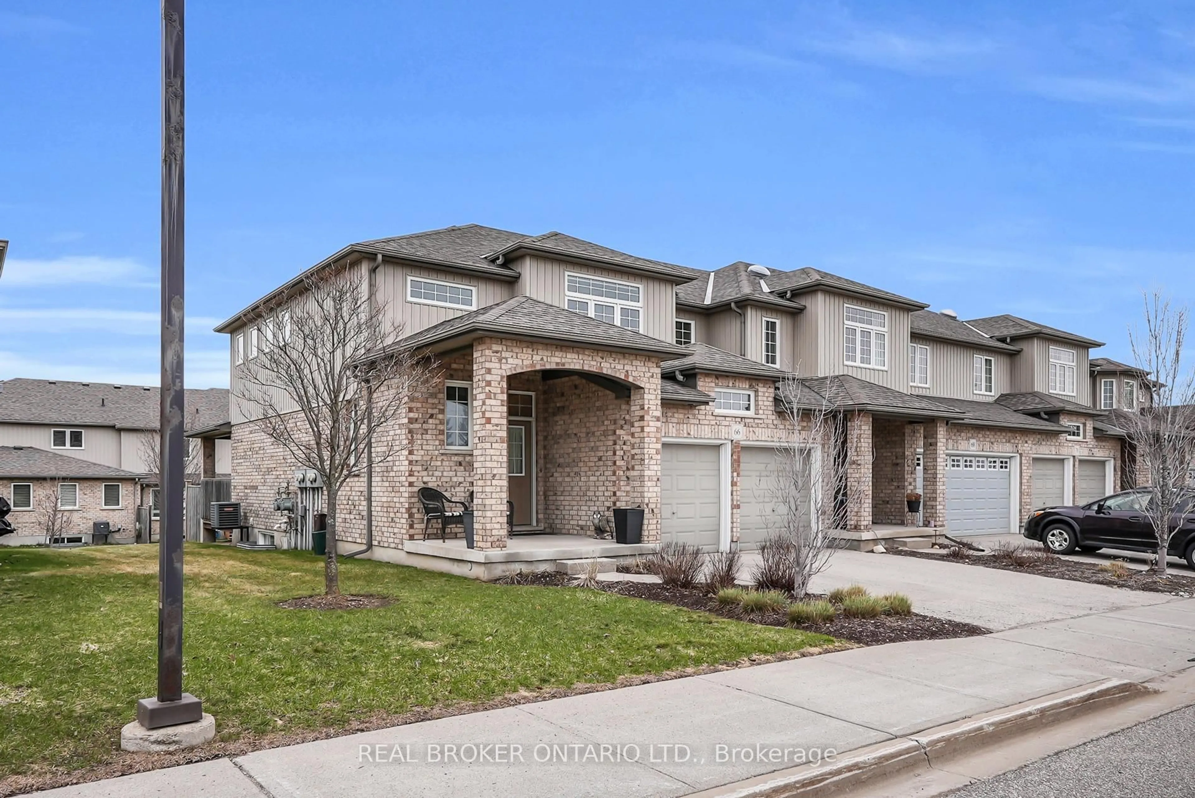 Home with brick exterior material, street for 31 Townsend Dr #66, Woolwich Ontario N0B 1M0