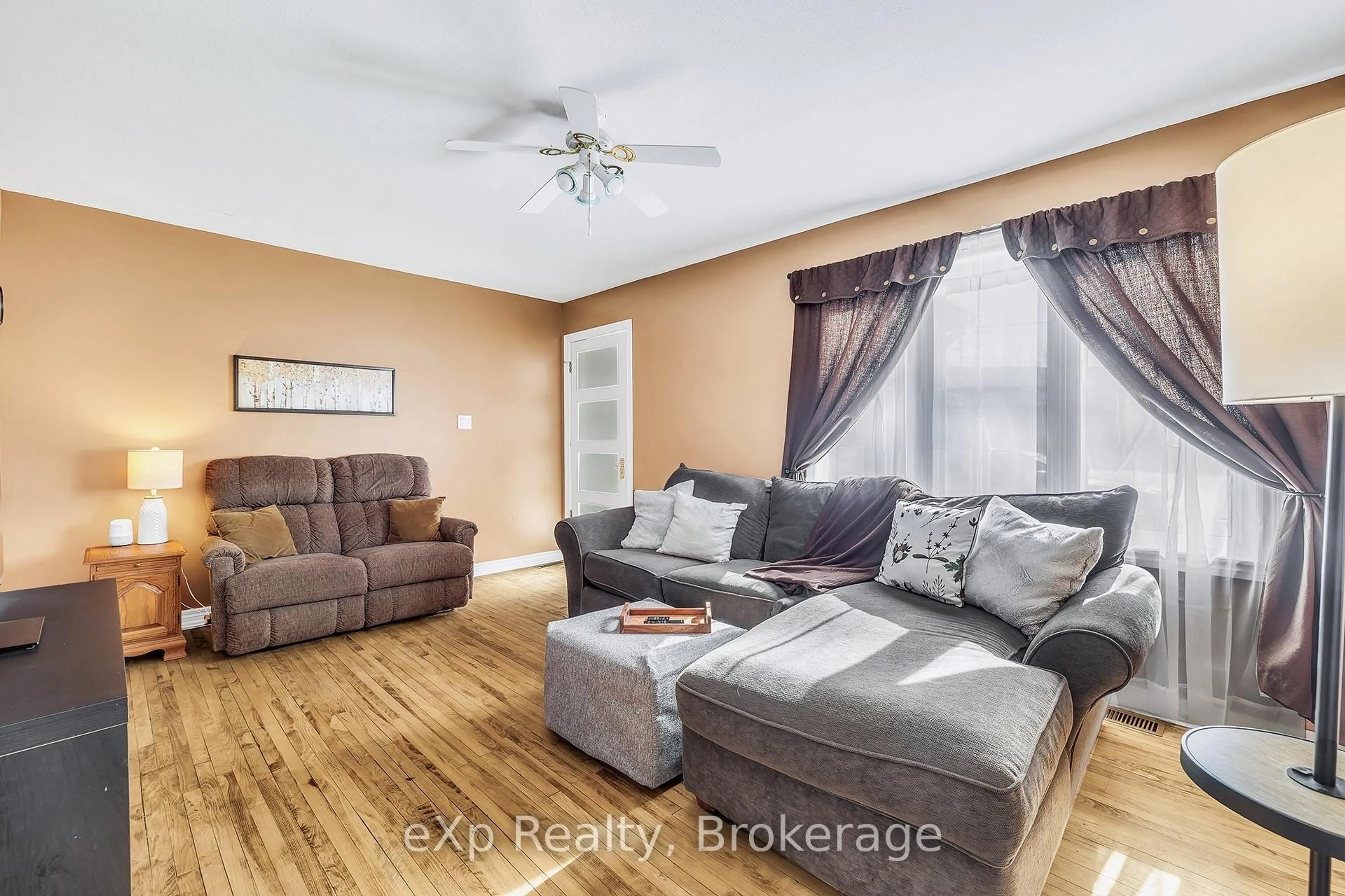 Living room with furniture, wood/laminate floor for 229 Havelock Ave, North Perth Ontario N4W 2A5