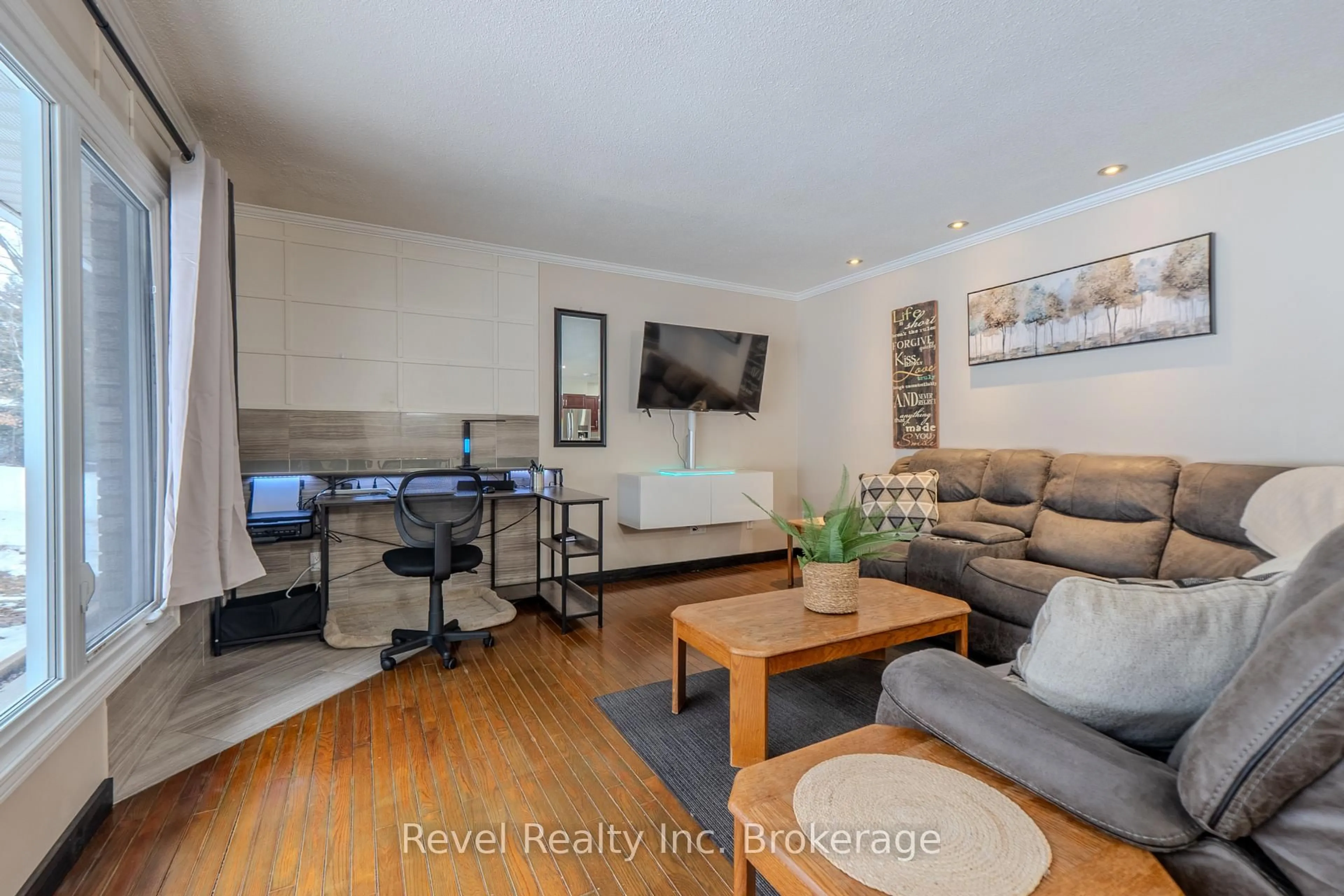 Living room with furniture, wood/laminate floor for 299 Astorville Rd, East Ferris Ontario P0H 1K0