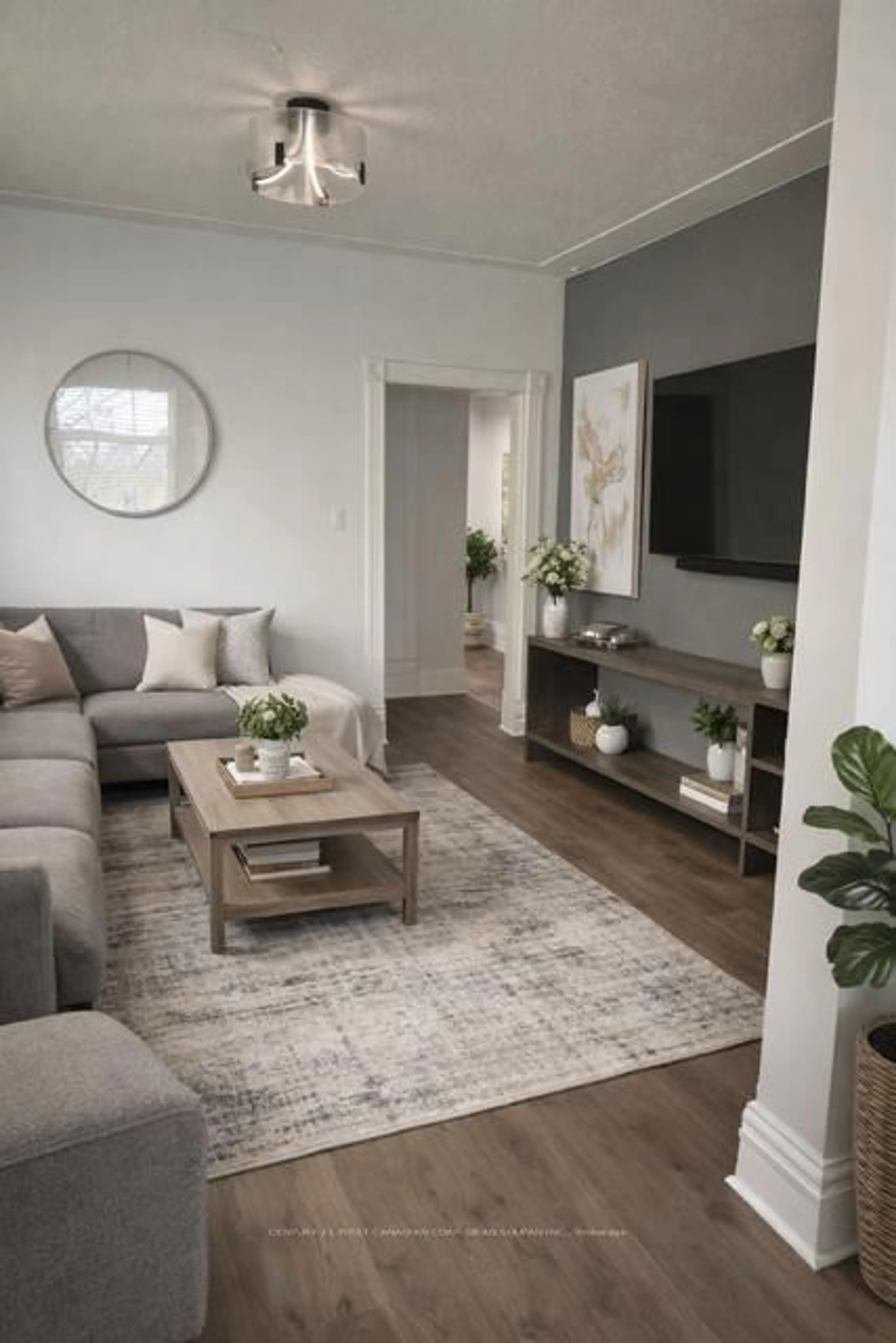 Living room with furniture, wood/laminate floor for 177 Central Ave, London East Ontario N6A 1M6