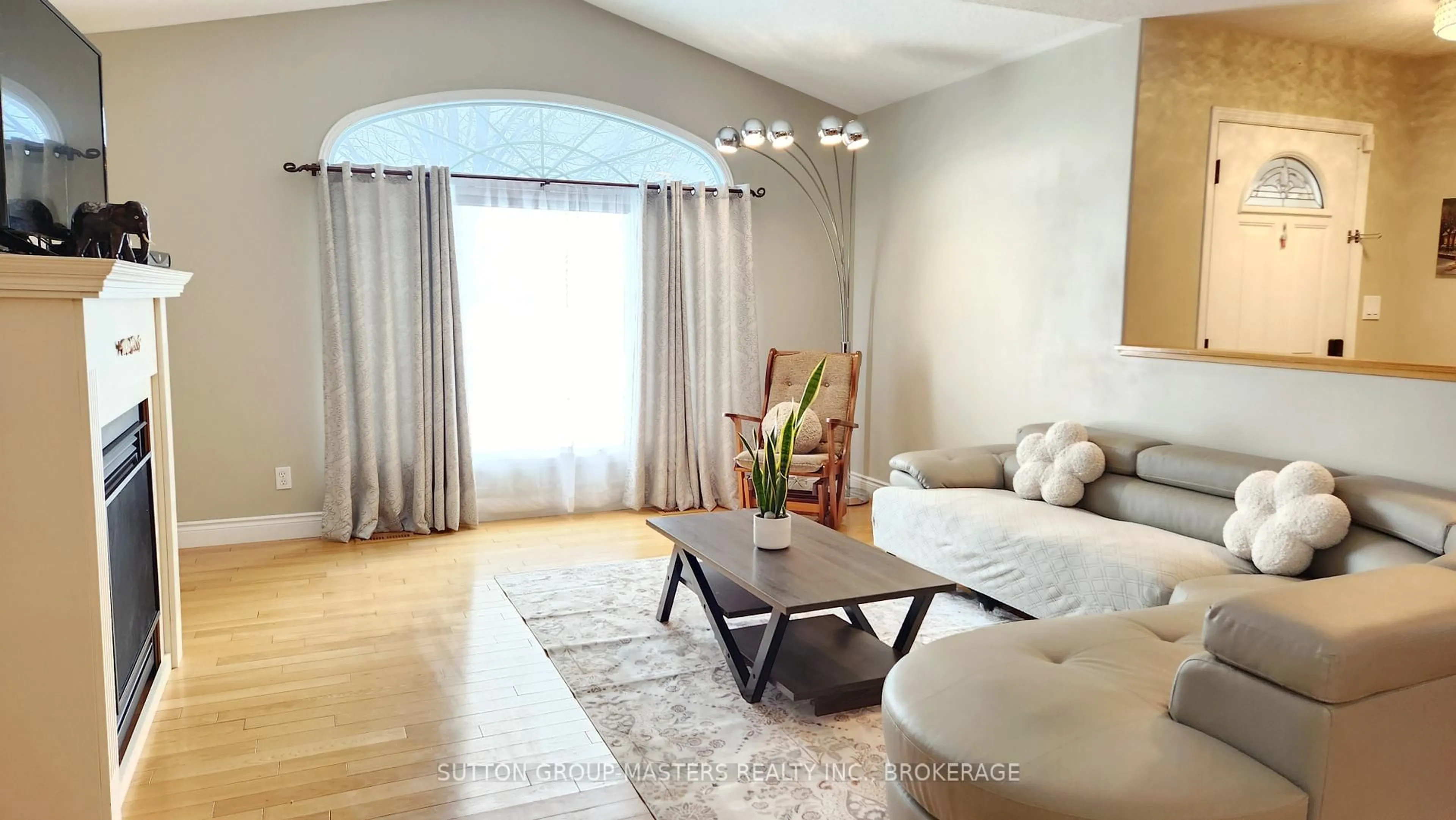 Living room with furniture, wood/laminate floor for 178 Langfield St, Kingston Ontario K7P 3J3