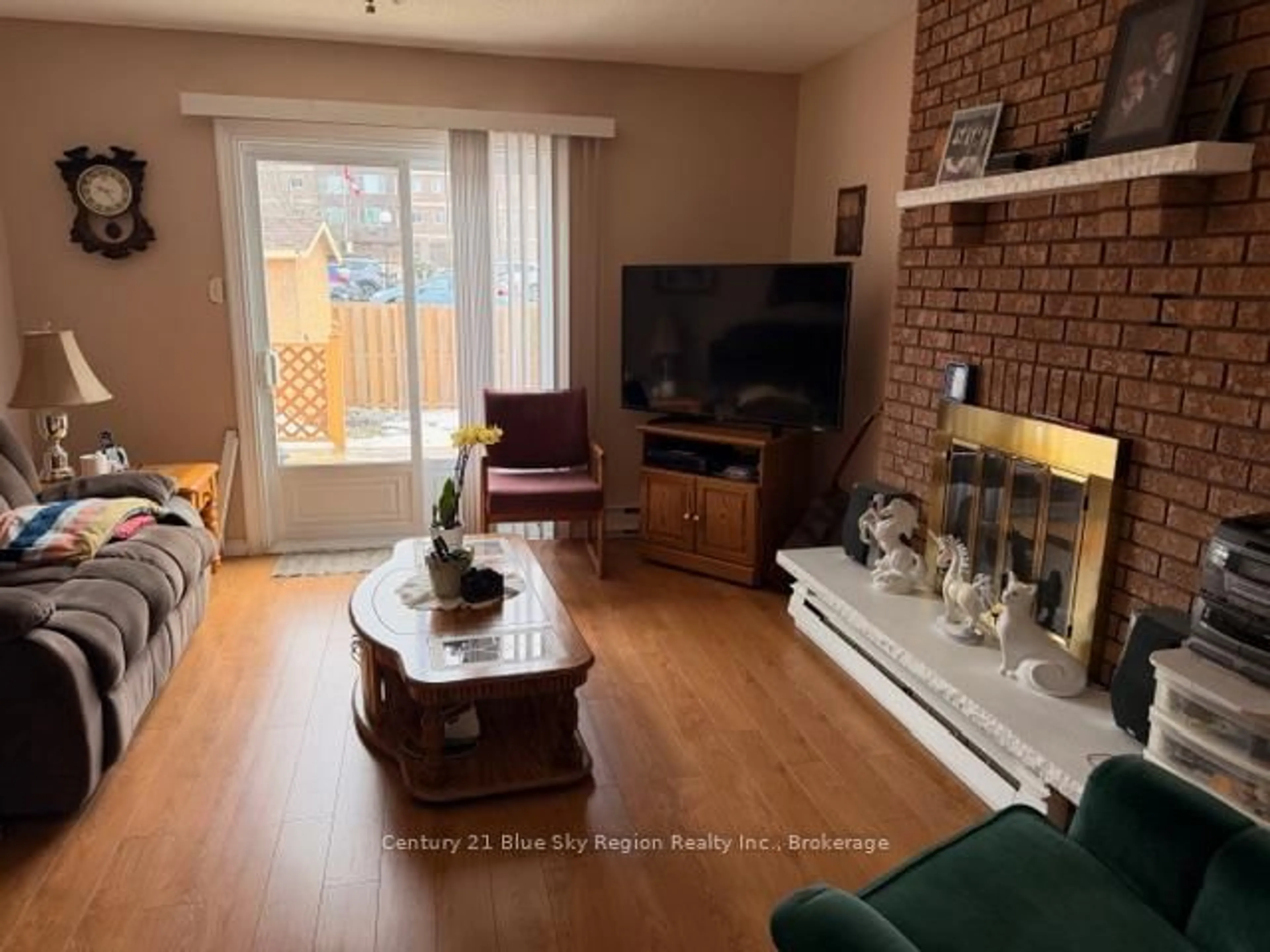 Living room with furniture, wood/laminate floor for 124 Blair St, North Bay Ontario P1A 4E7