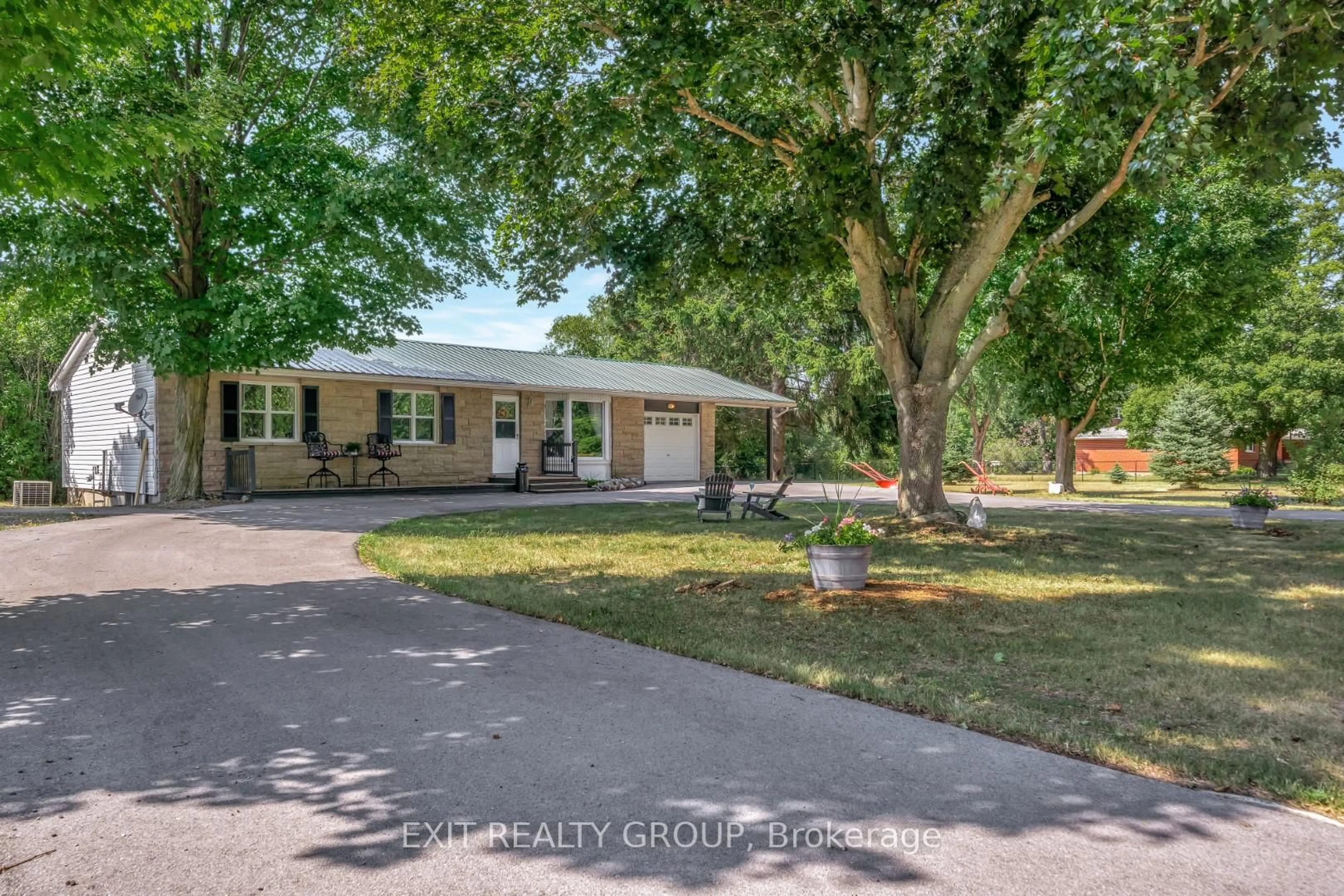 A pic from outside/outdoor area/front of a property/back of a property/a pic from drone, street for 1476 County Rd 12, Prince Edward County Ontario K0K 2T0