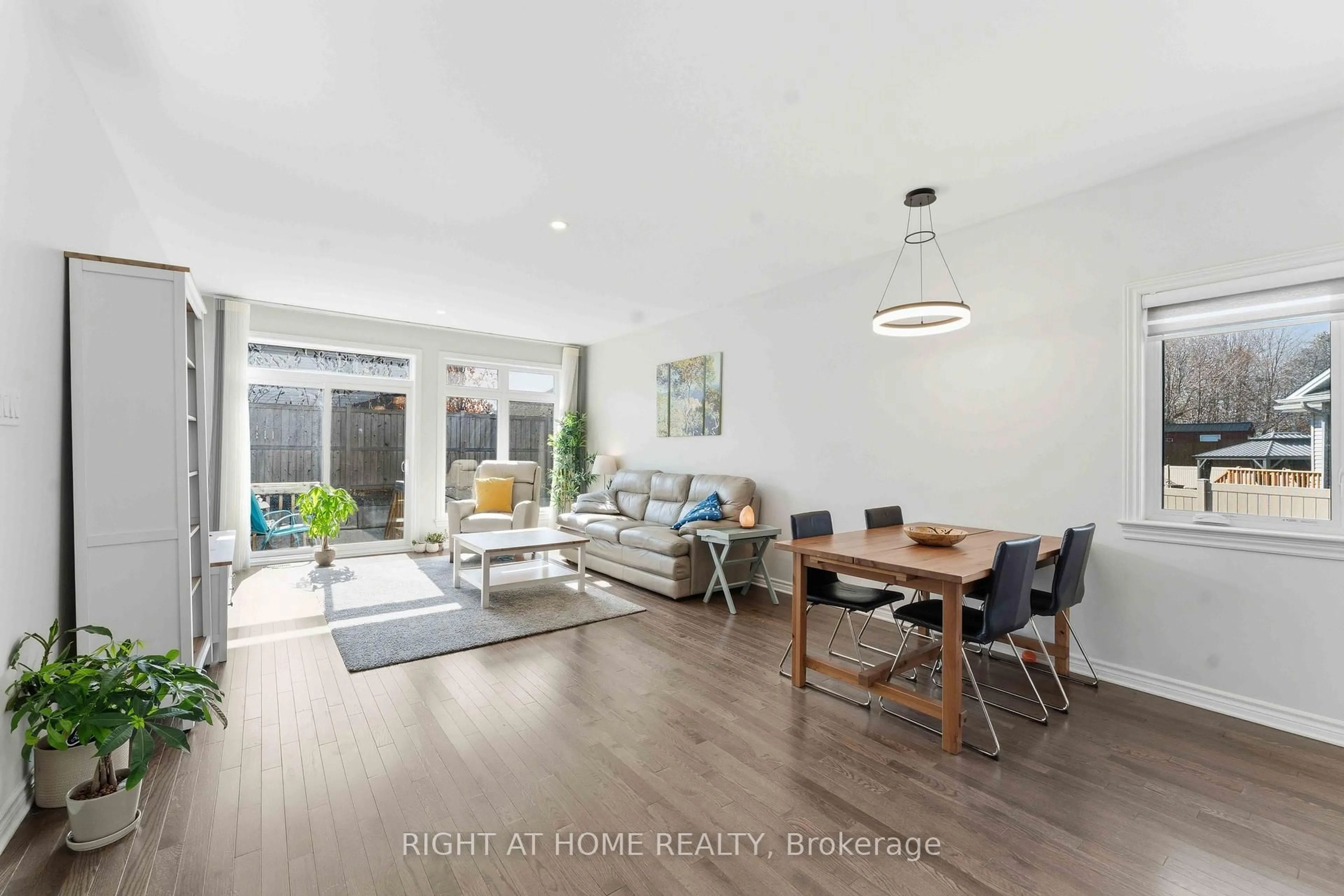Living room with furniture, wood/laminate floor for 272 Maygrass Way, Ottawa Ontario K2S 2K9