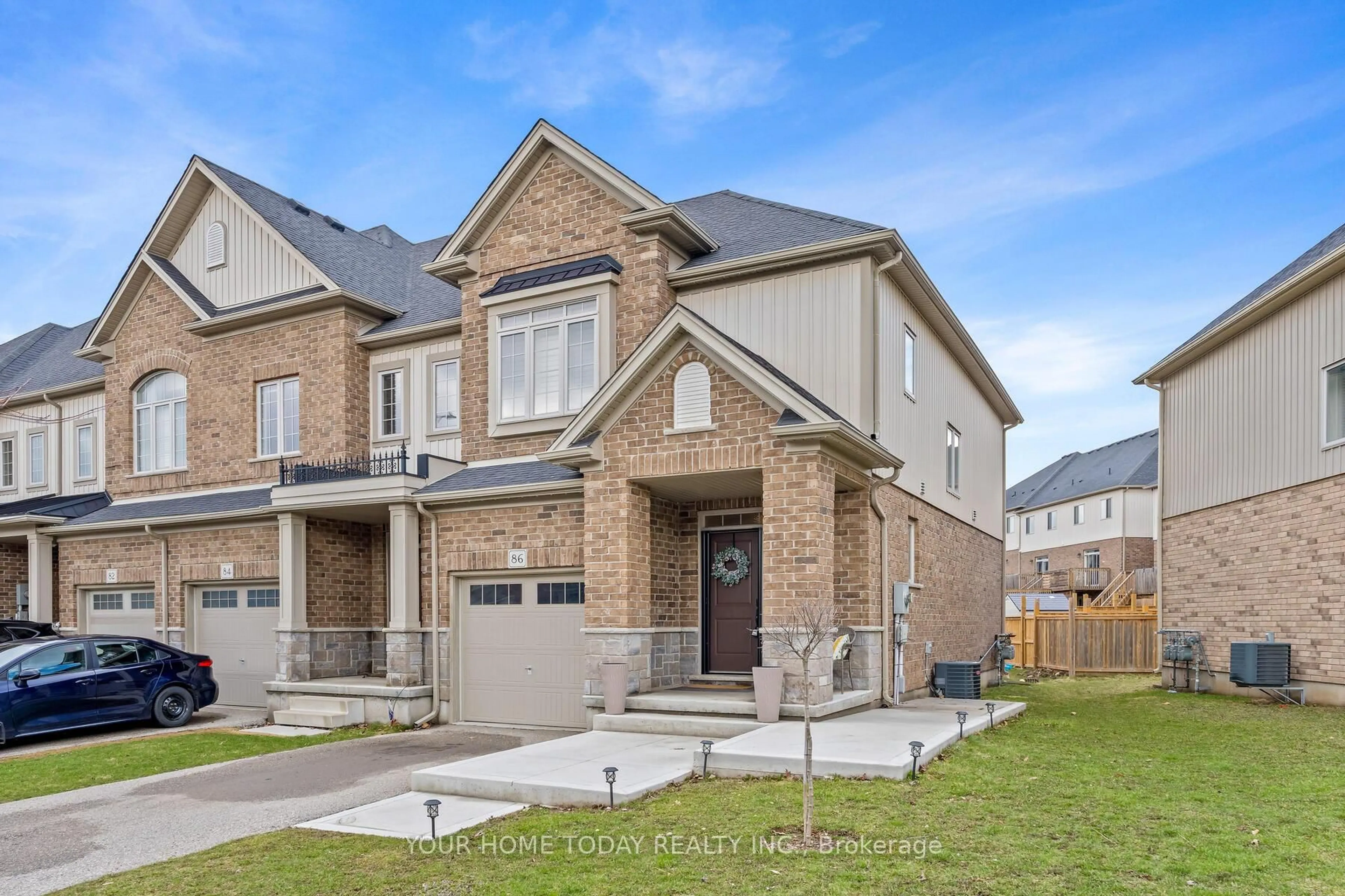 Home with brick exterior material, street for 86 Pettitt Dr, Guelph Ontario N1E 0M2