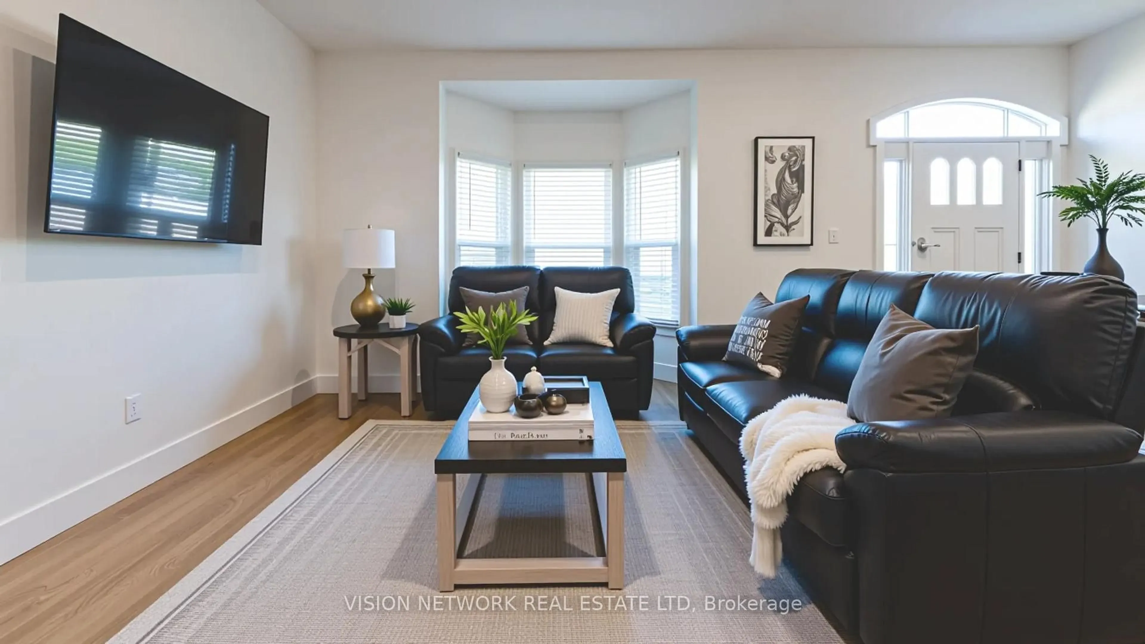 Living room with furniture, wood/laminate floor for 117 Wharncliffe Rd, London North Ontario N6H 2A8