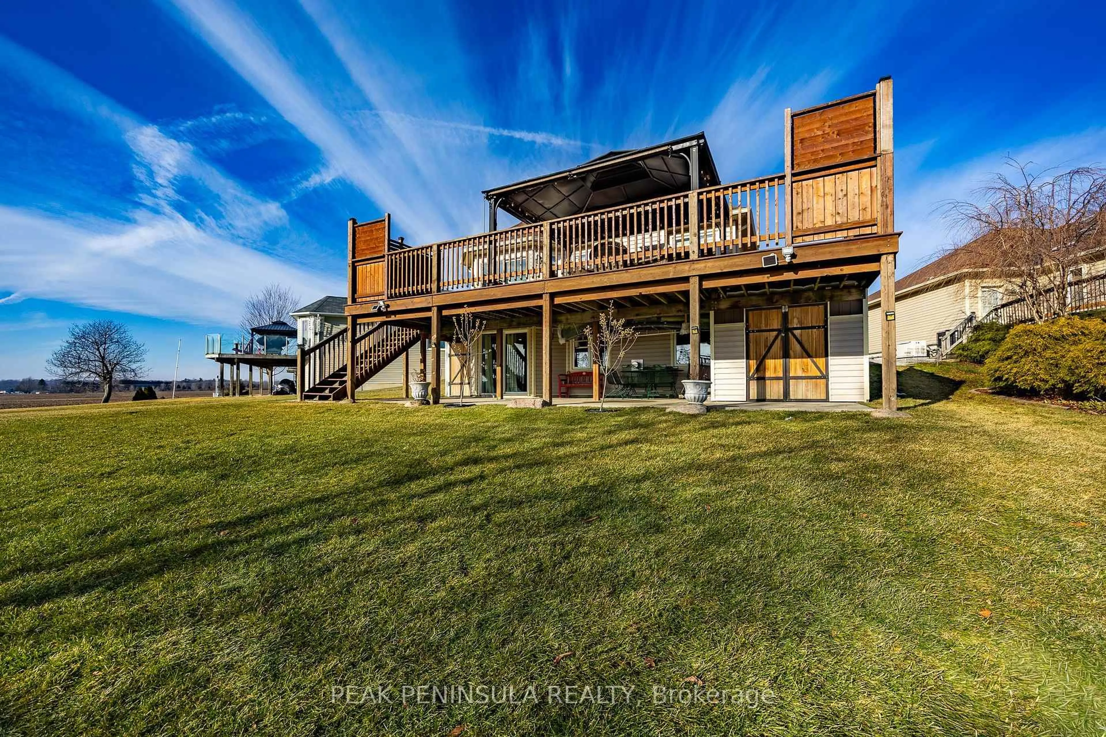 A pic from outside/outdoor area/front of a property/back of a property/a pic from drone, water/lake/river/ocean view for 63 Upper Canada Dr, Norfolk Ontario N0E 1M0