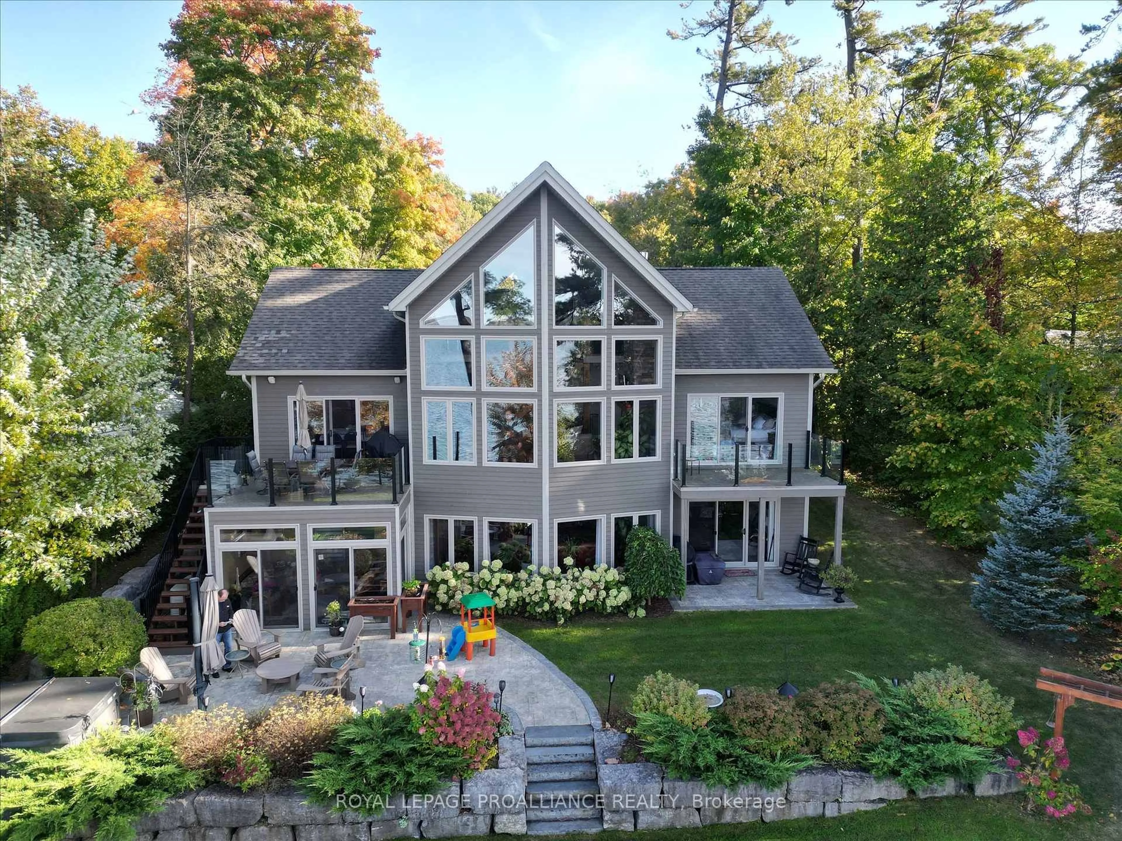 A pic from outside/outdoor area/front of a property/back of a property/a pic from drone, water/lake/river/ocean view for 668 Hatton Ave, Selwyn Ontario K0L 1T0