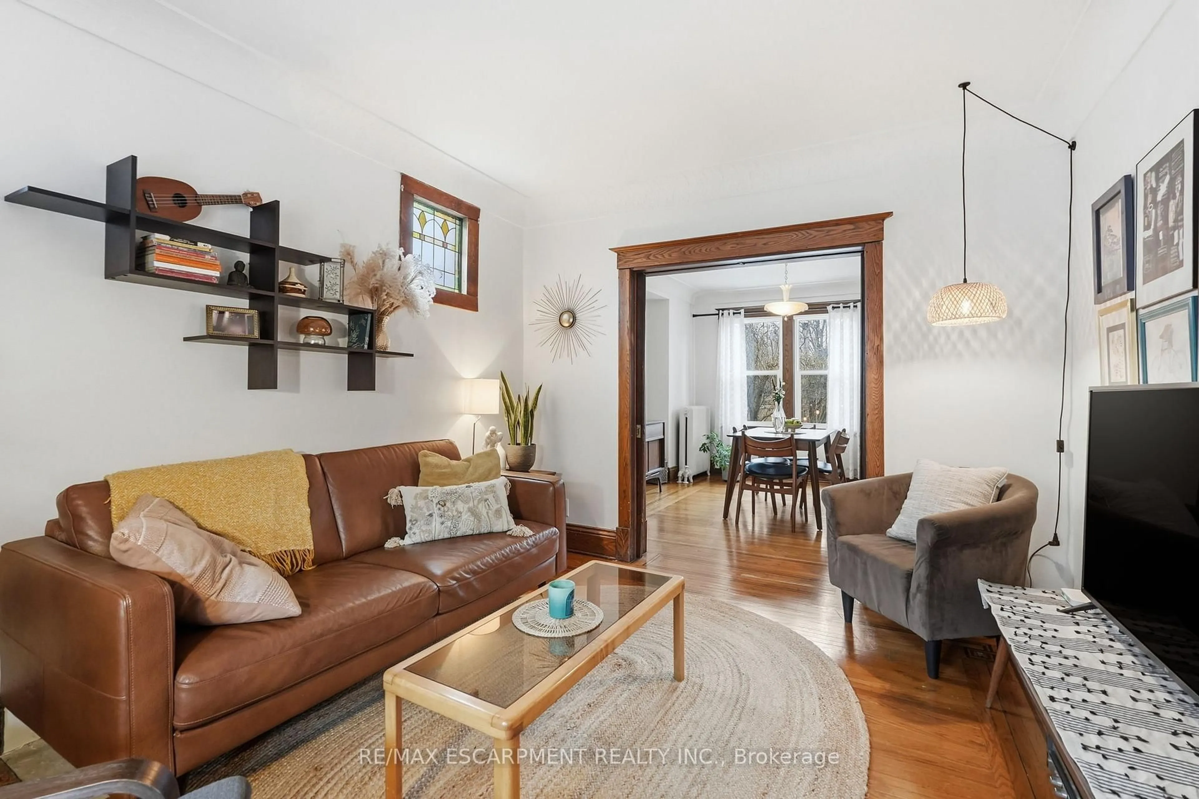 Living room with furniture, wood/laminate floor for 1 Rutherford Ave, Hamilton Ontario L8M 1Y3