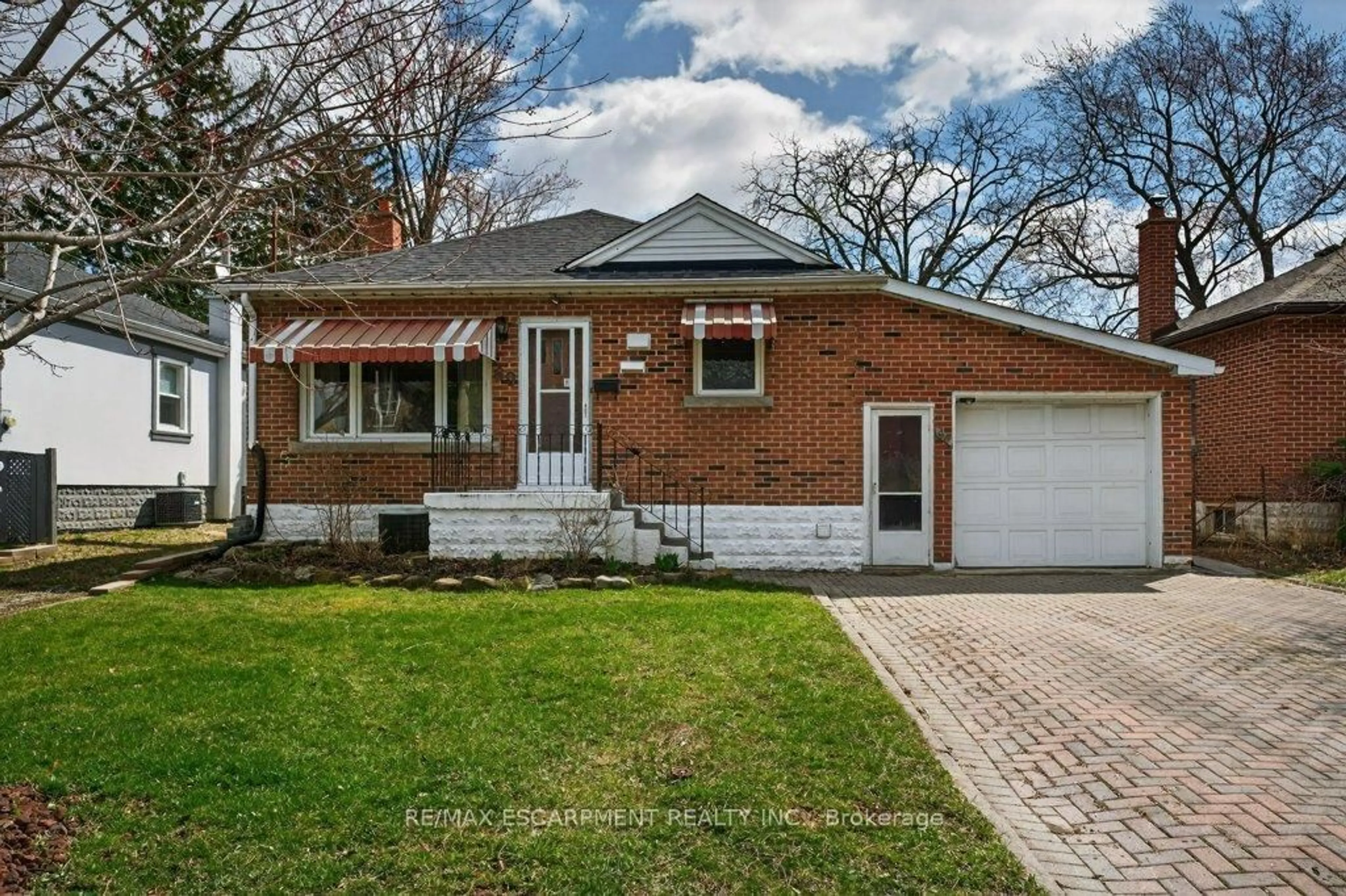 Home with brick exterior material, street for 69 West 4th St, Hamilton Ontario L9C 3M6