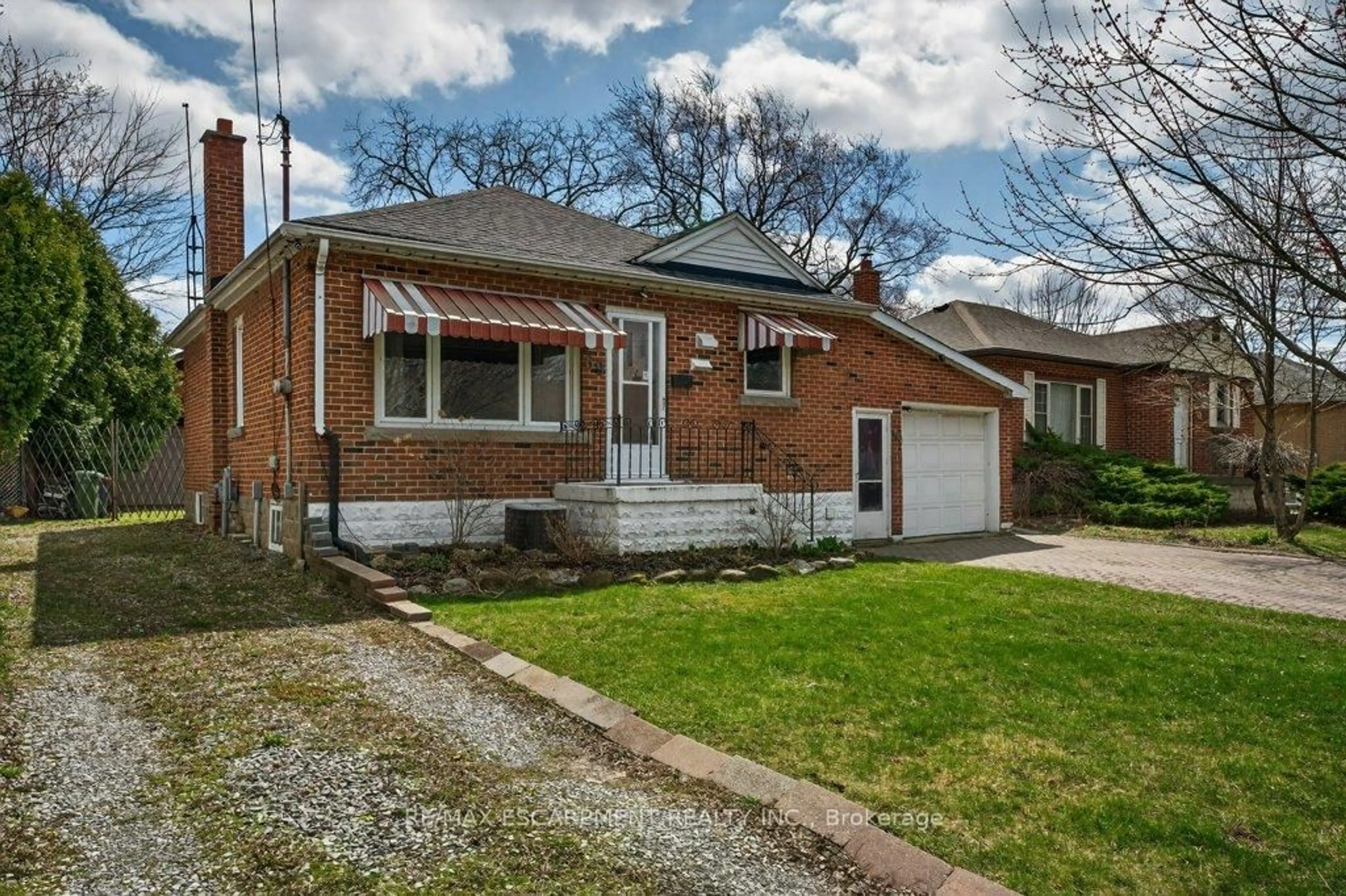 Home with brick exterior material, street for 69 West 4th St, Hamilton Ontario L9C 3M6