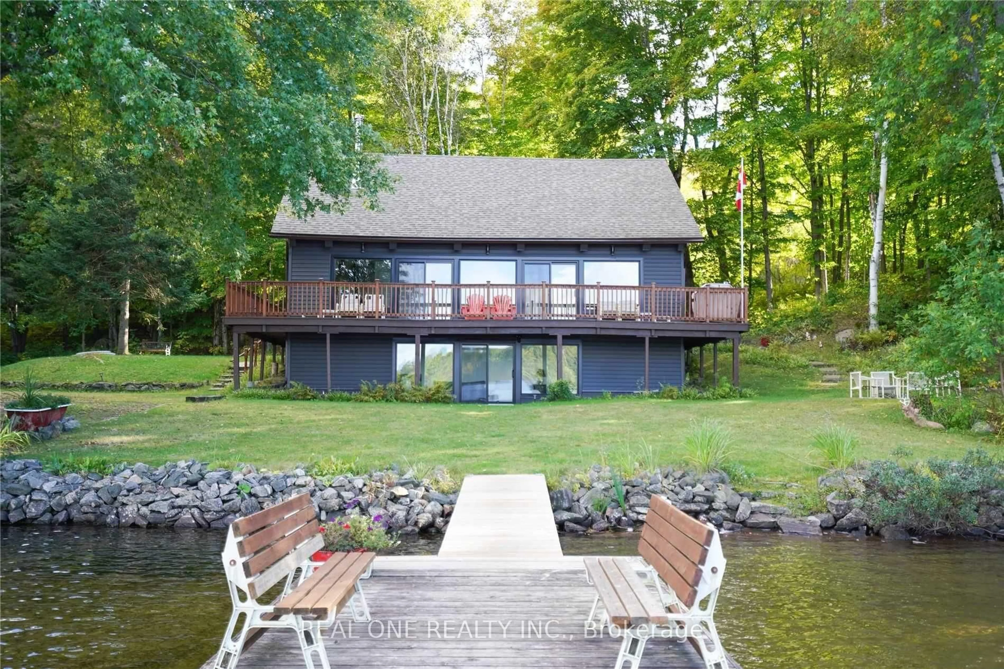A pic from outside/outdoor area/front of a property/back of a property/a pic from drone, water/lake/river/ocean view for 1 Muskoka Estates Rd, Muskoka Lakes Ontario P0B 1J0
