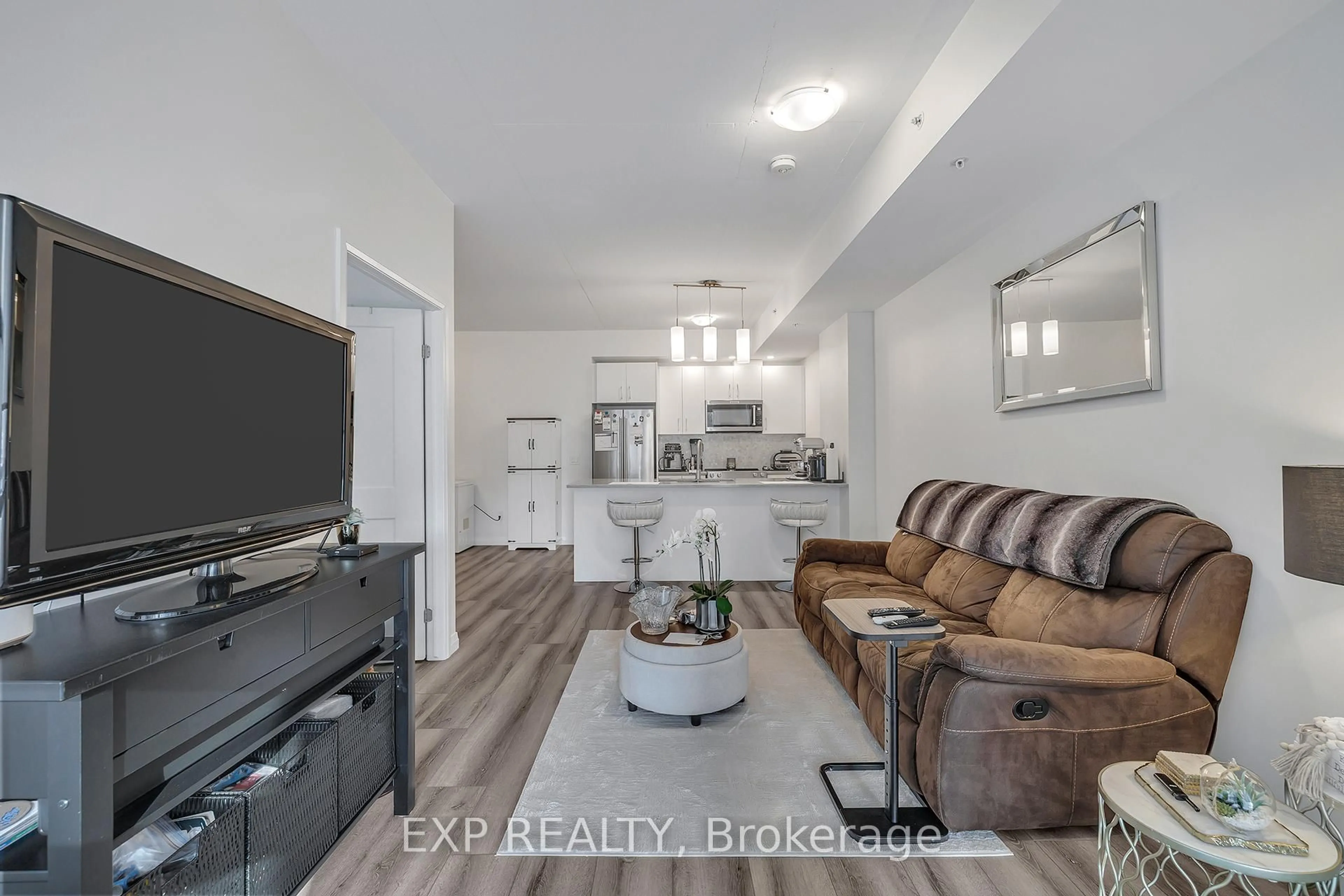 Living room with furniture, unknown for 108 Garment St #201, Kitchener Ontario N2G 0E2