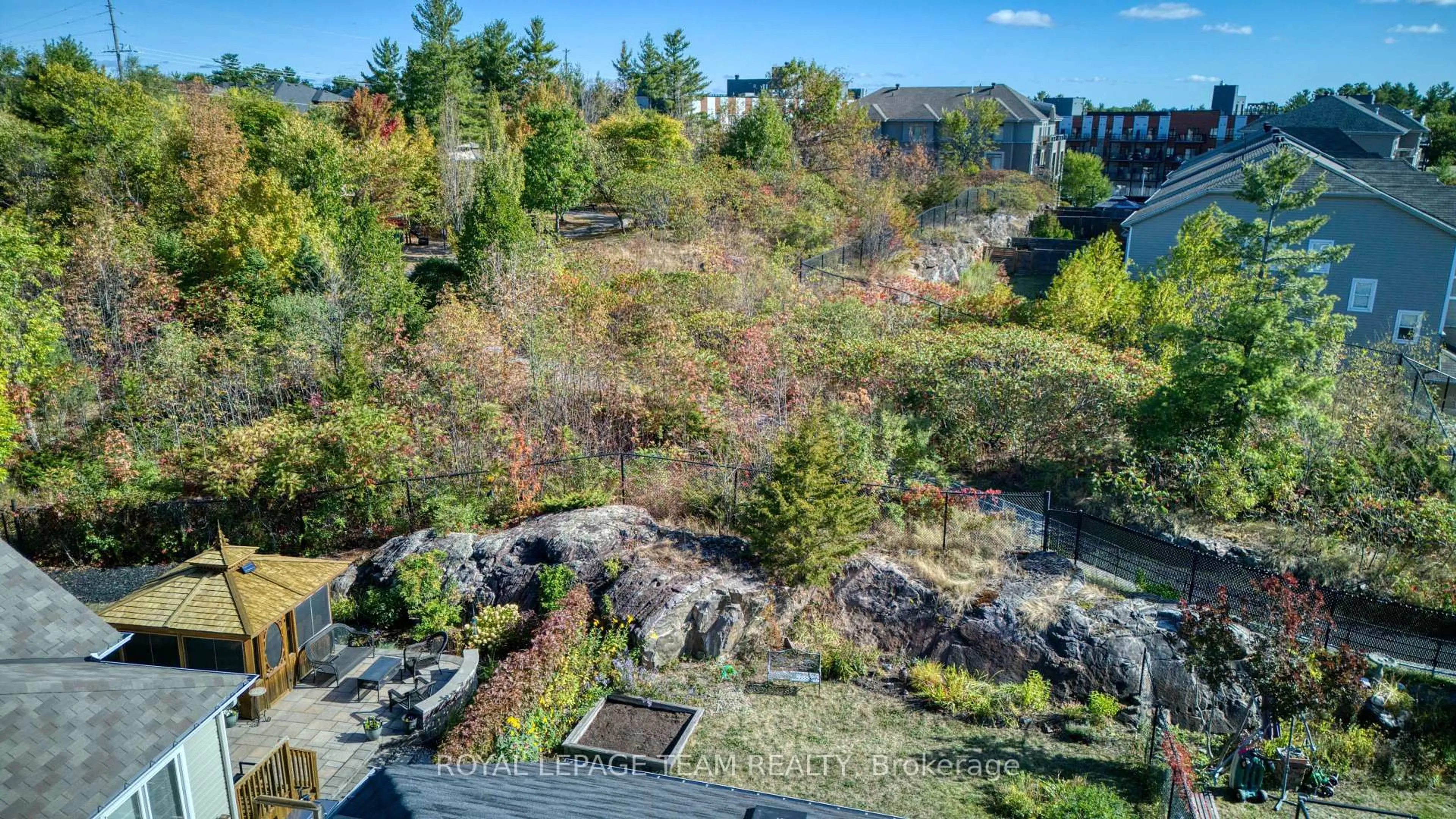 A pic from outside/outdoor area/front of a property/back of a property/a pic from drone, forest/trees view for 249 Huntsville Dr, Kanata Ontario K2T 0C5