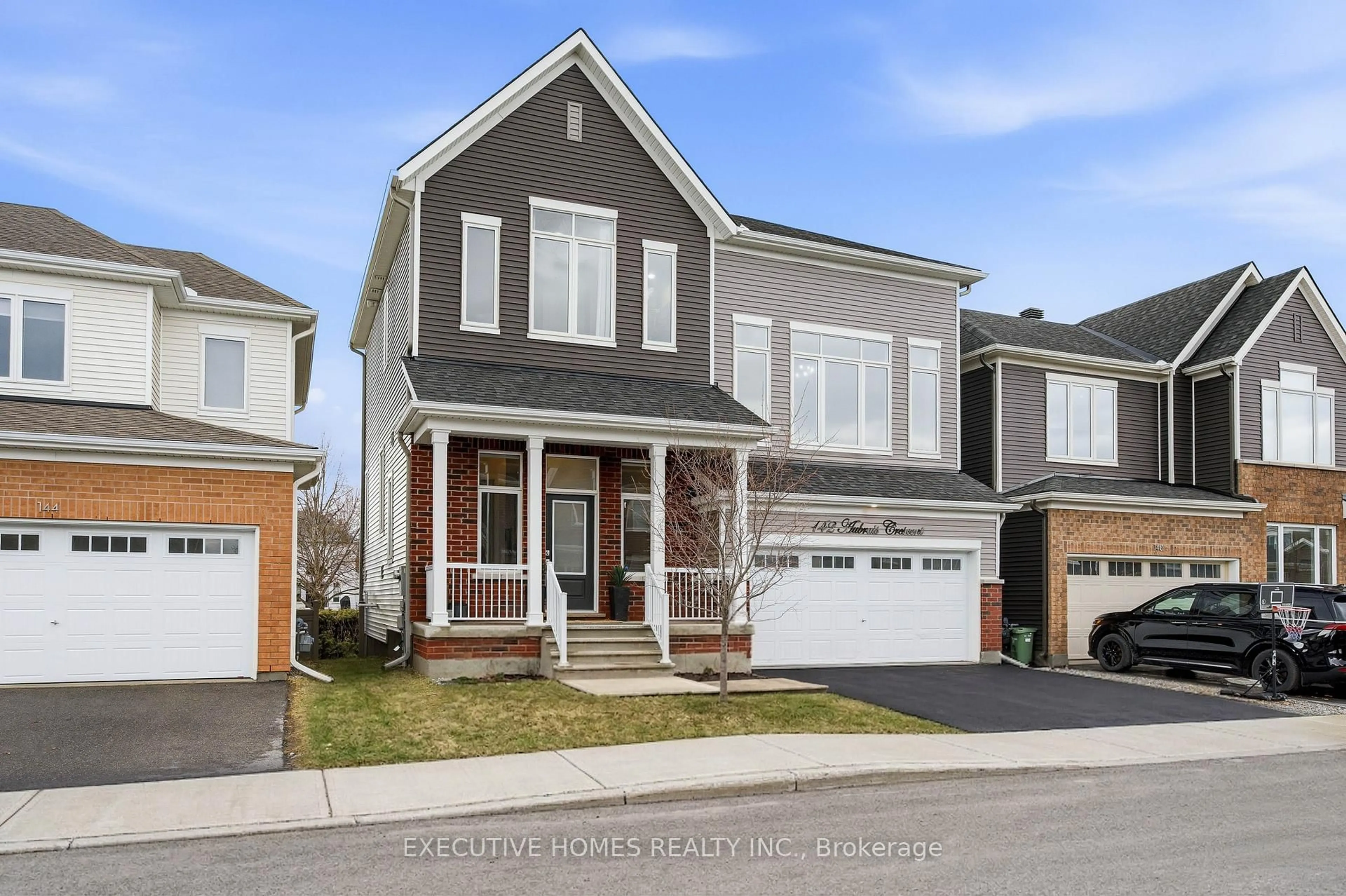 Home with vinyl exterior material, street for 142 Aubrais Cres, Ottawa Ontario K1W 0N1