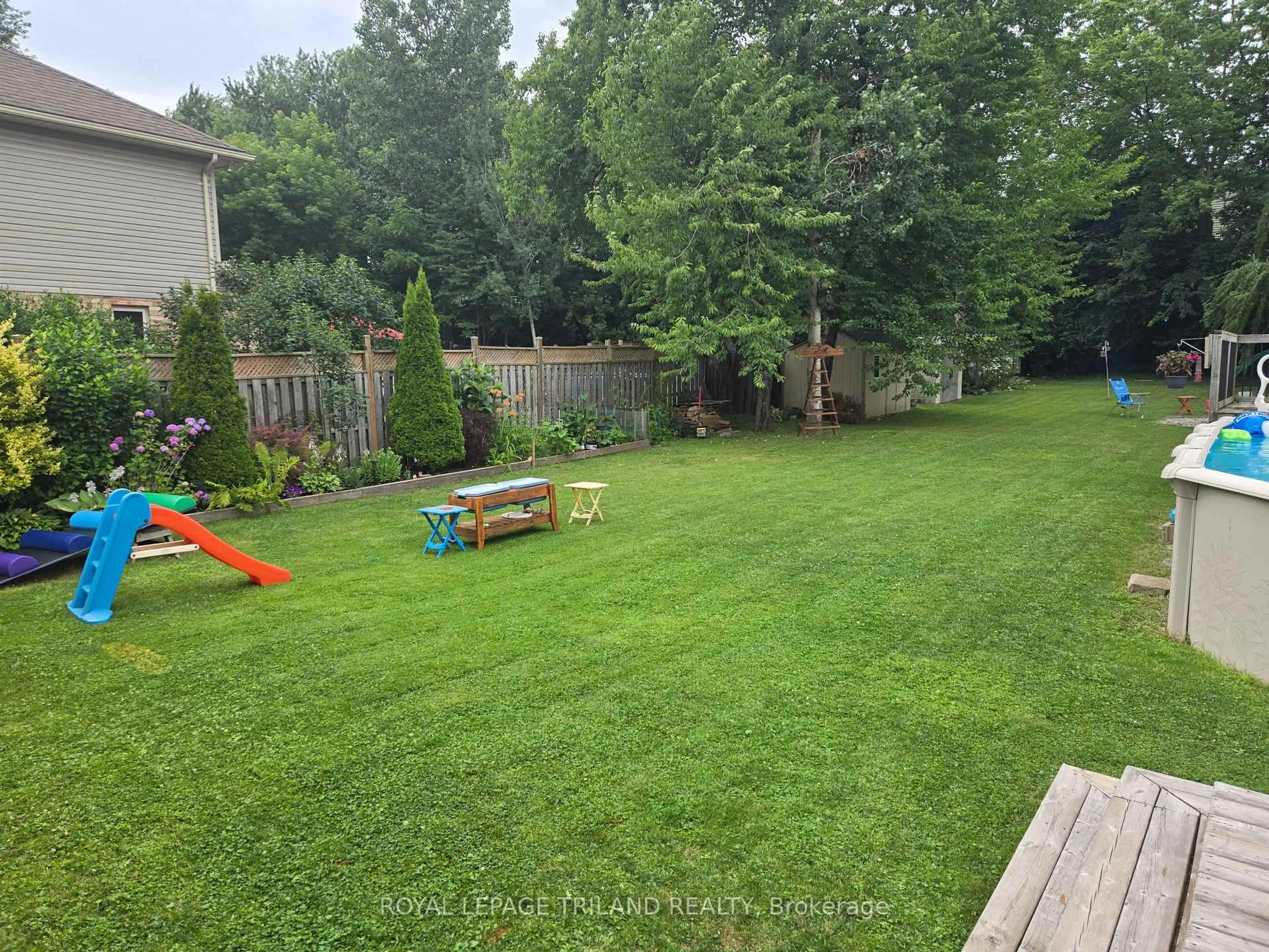 A pic from outside/outdoor area/front of a property/back of a property/a pic from drone, forest/trees view for 662 Eden Ave, London South Ontario N6C 2Z7