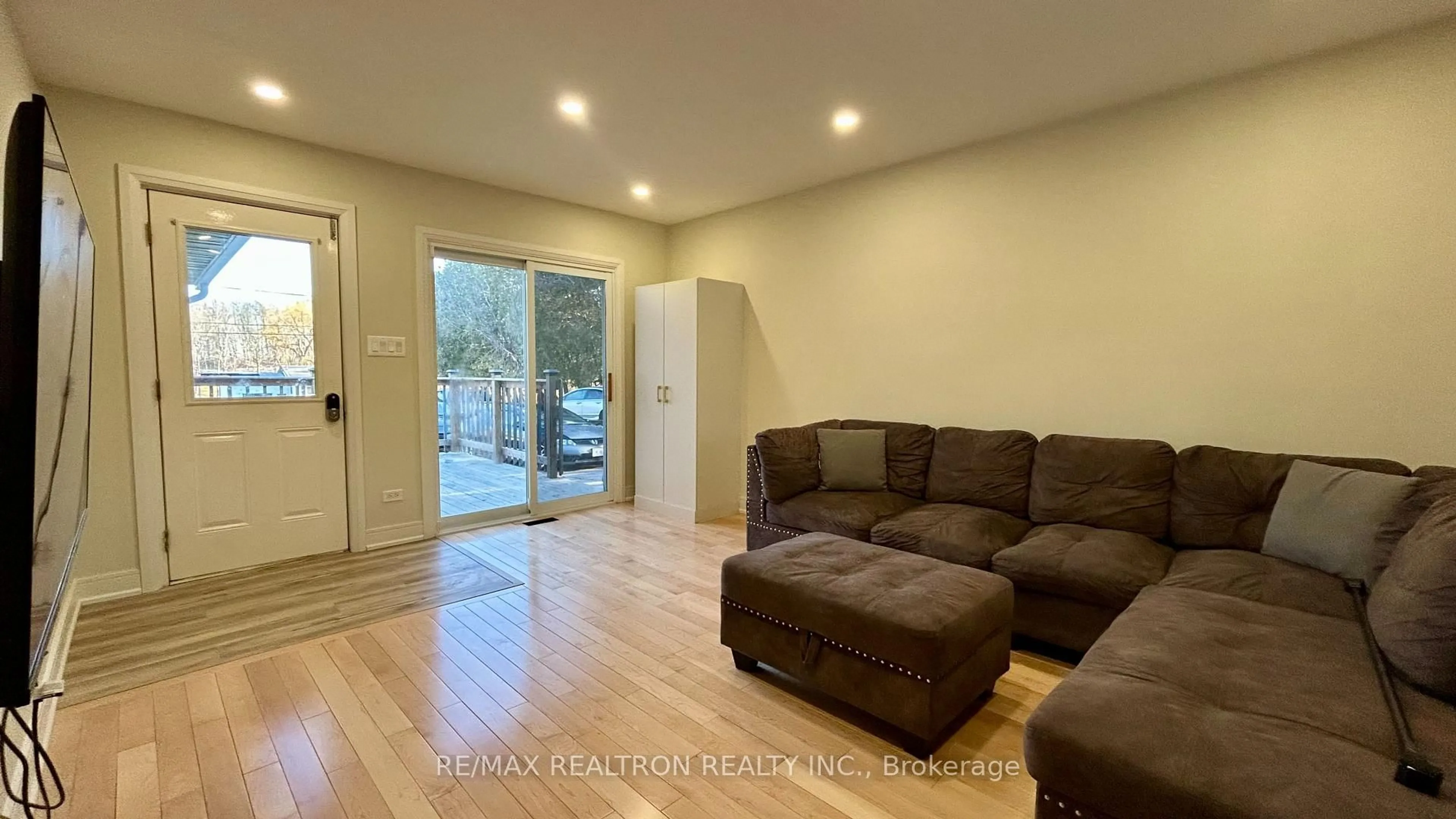 Living room with furniture, wood/laminate floor for 62 Hillcrest Dr, Quinte West Ontario K8V 0M6