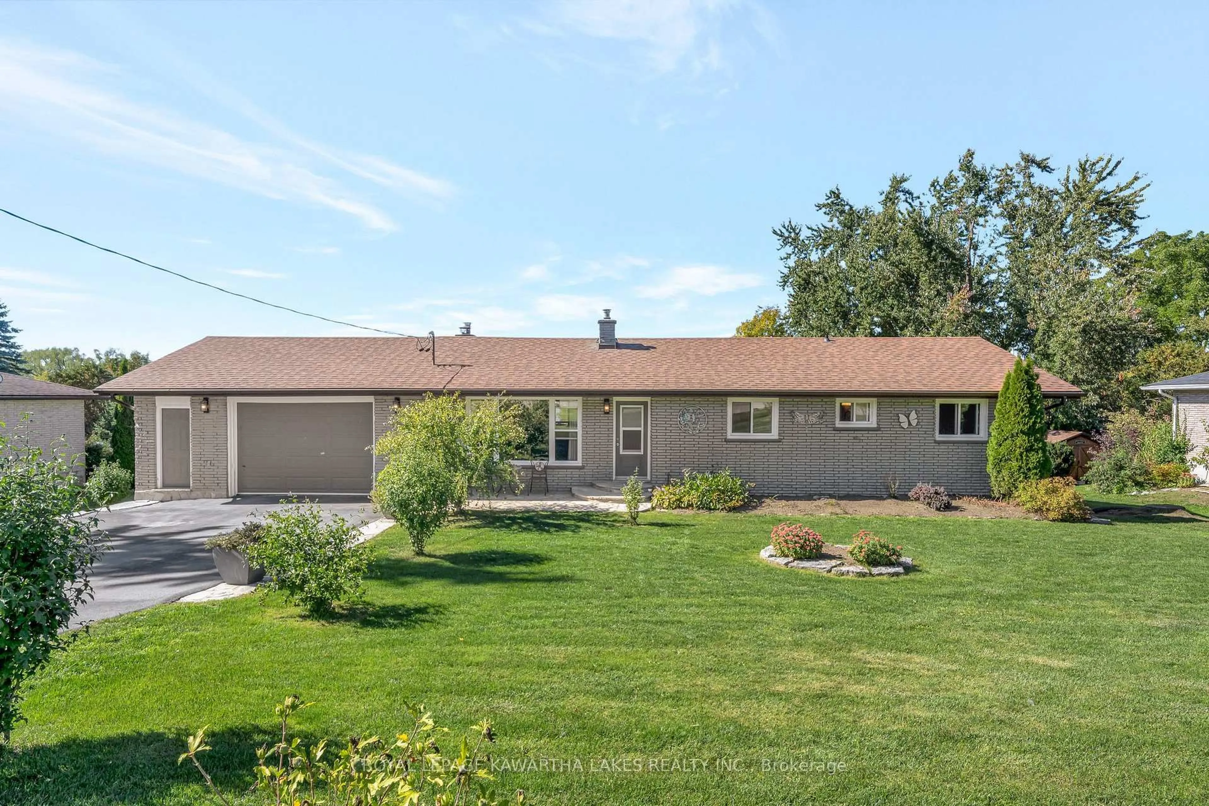 Home with vinyl exterior material, street for 9 Buckhorn Rd, Kawartha Lakes Ontario K9V 4R6