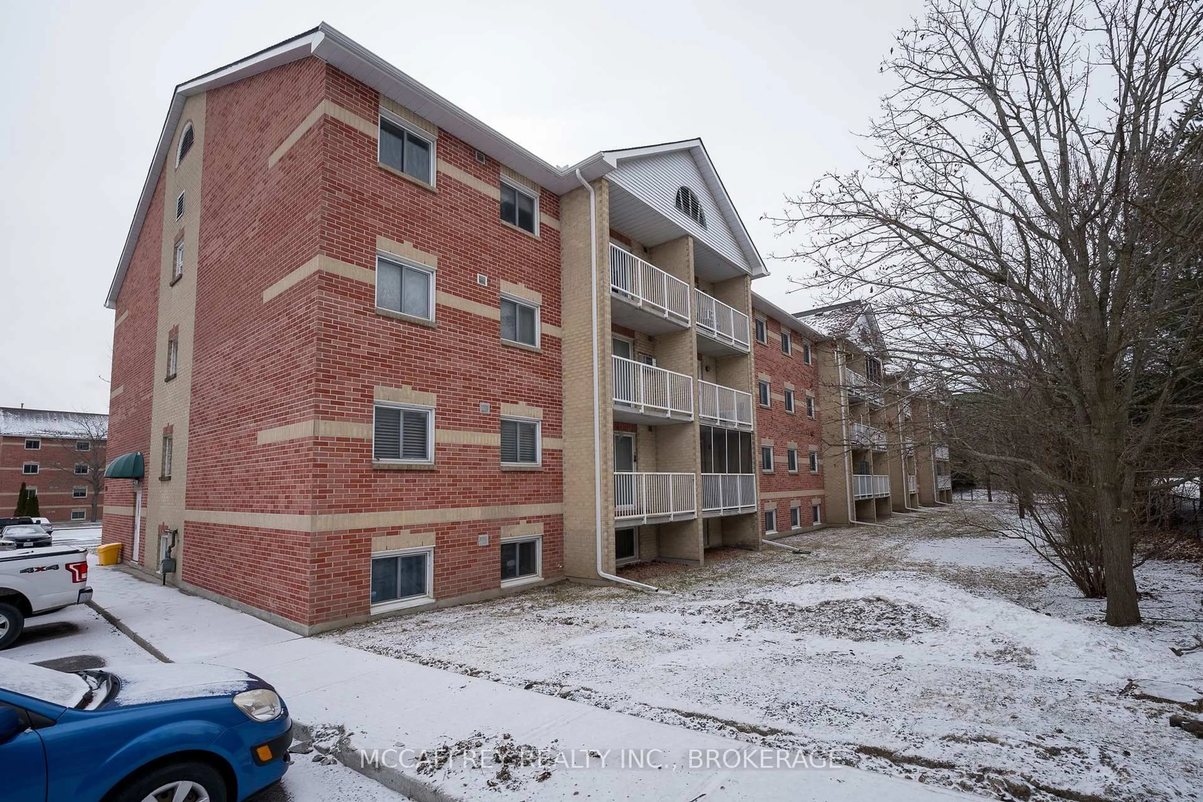 A pic from outside/outdoor area/front of a property/back of a property/a pic from drone, building for 310 Kingsdale Ave #103, Kingston Ontario K7M 8S1