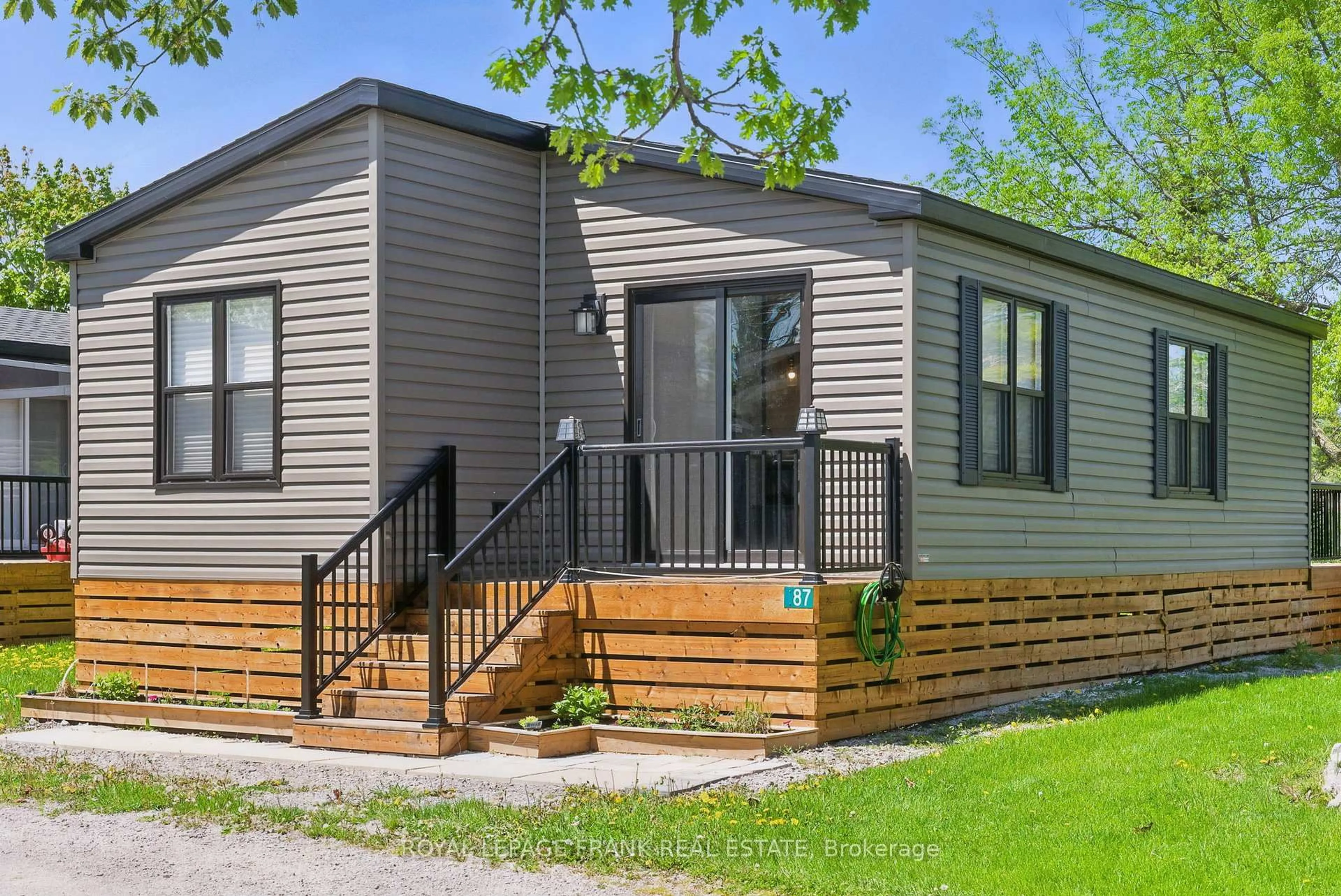 Home with vinyl exterior material, street for 657 Thunder Bridge Rd #87, Kawartha Lakes Ontario K9V 4R1