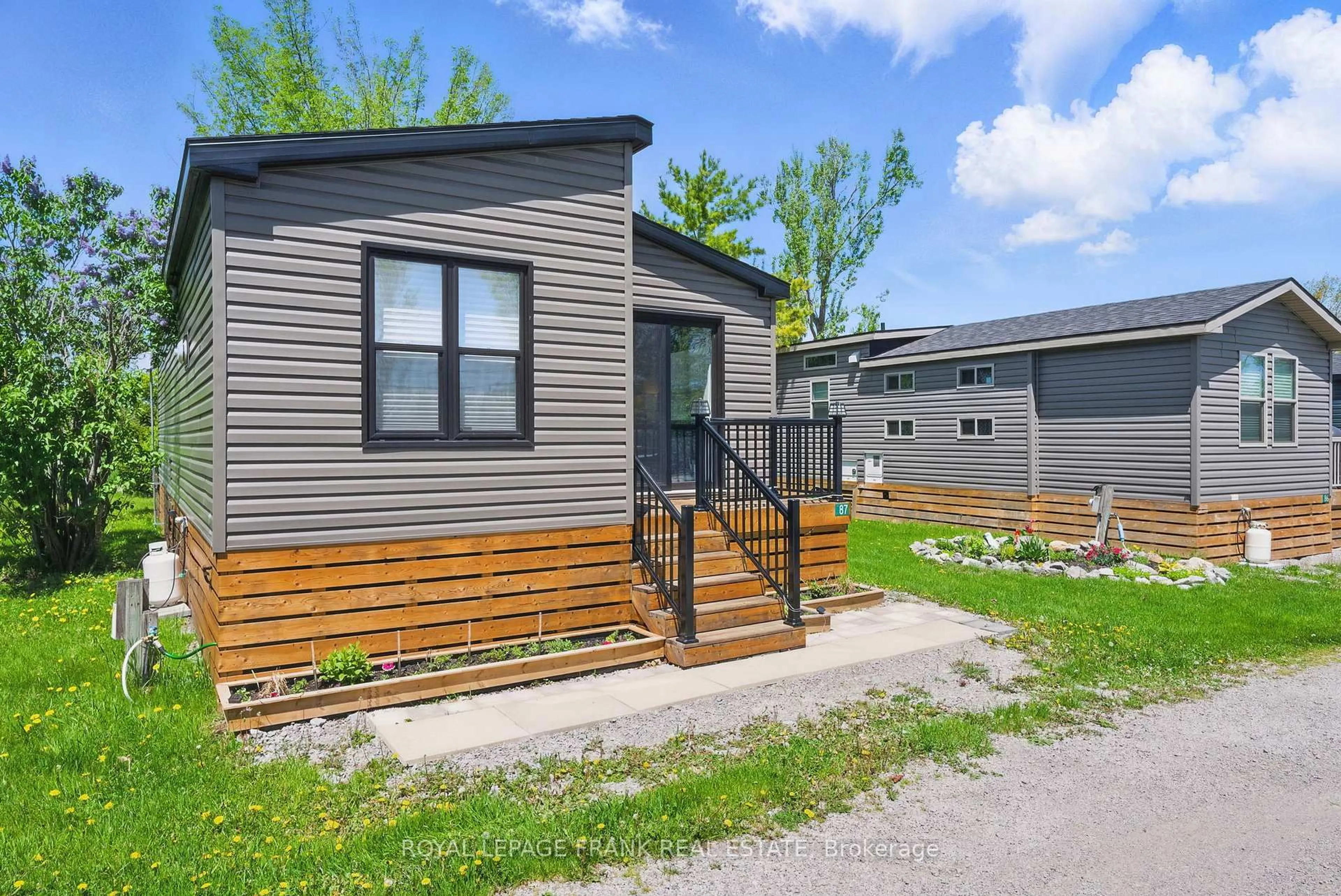 Home with vinyl exterior material, street for 657 Thunder Bridge Rd #87, Kawartha Lakes Ontario K9V 4R1