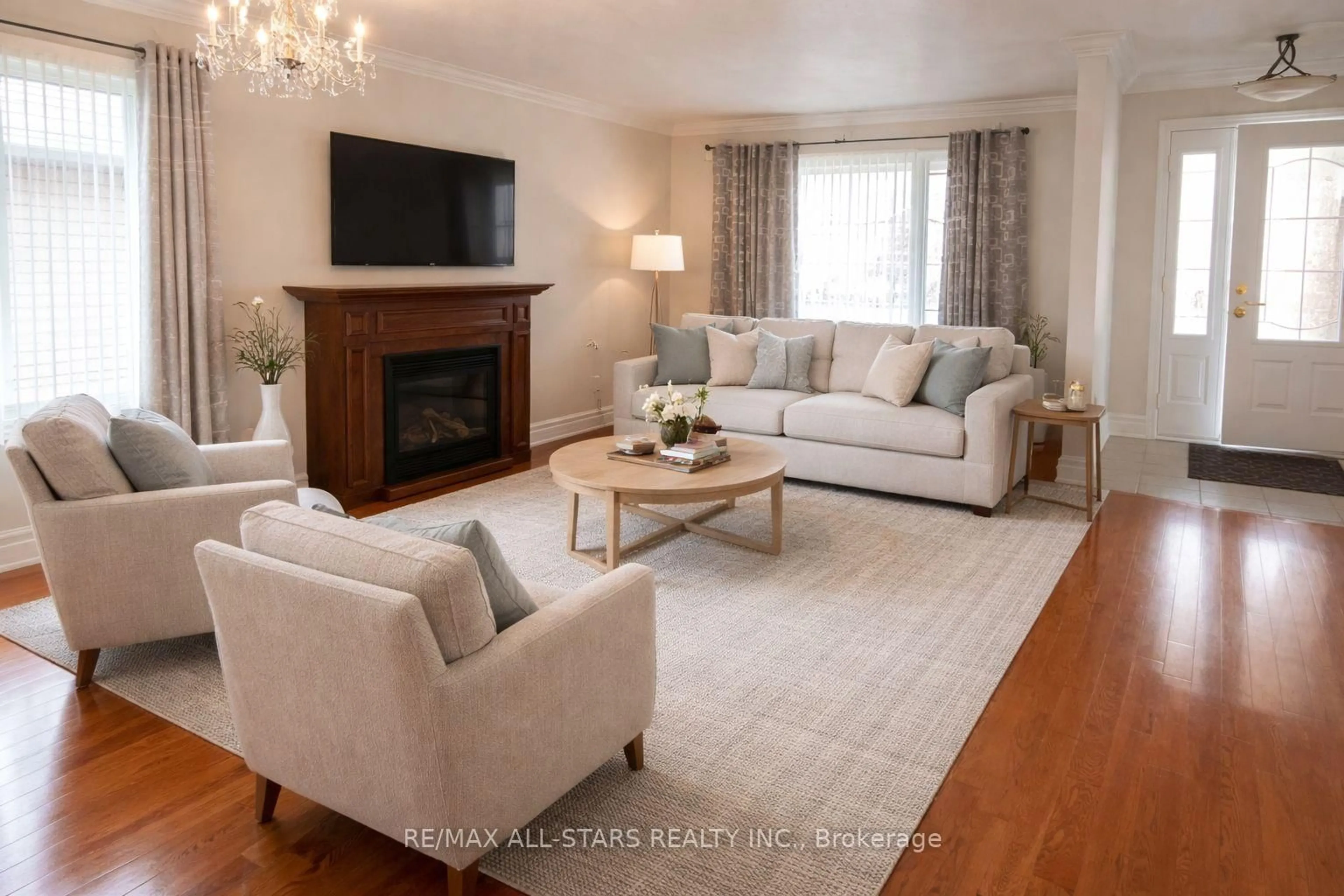 Living room with furniture, wood/laminate floor for 383 Wallace Dr, Kawartha Lakes Ontario K9V 6K7