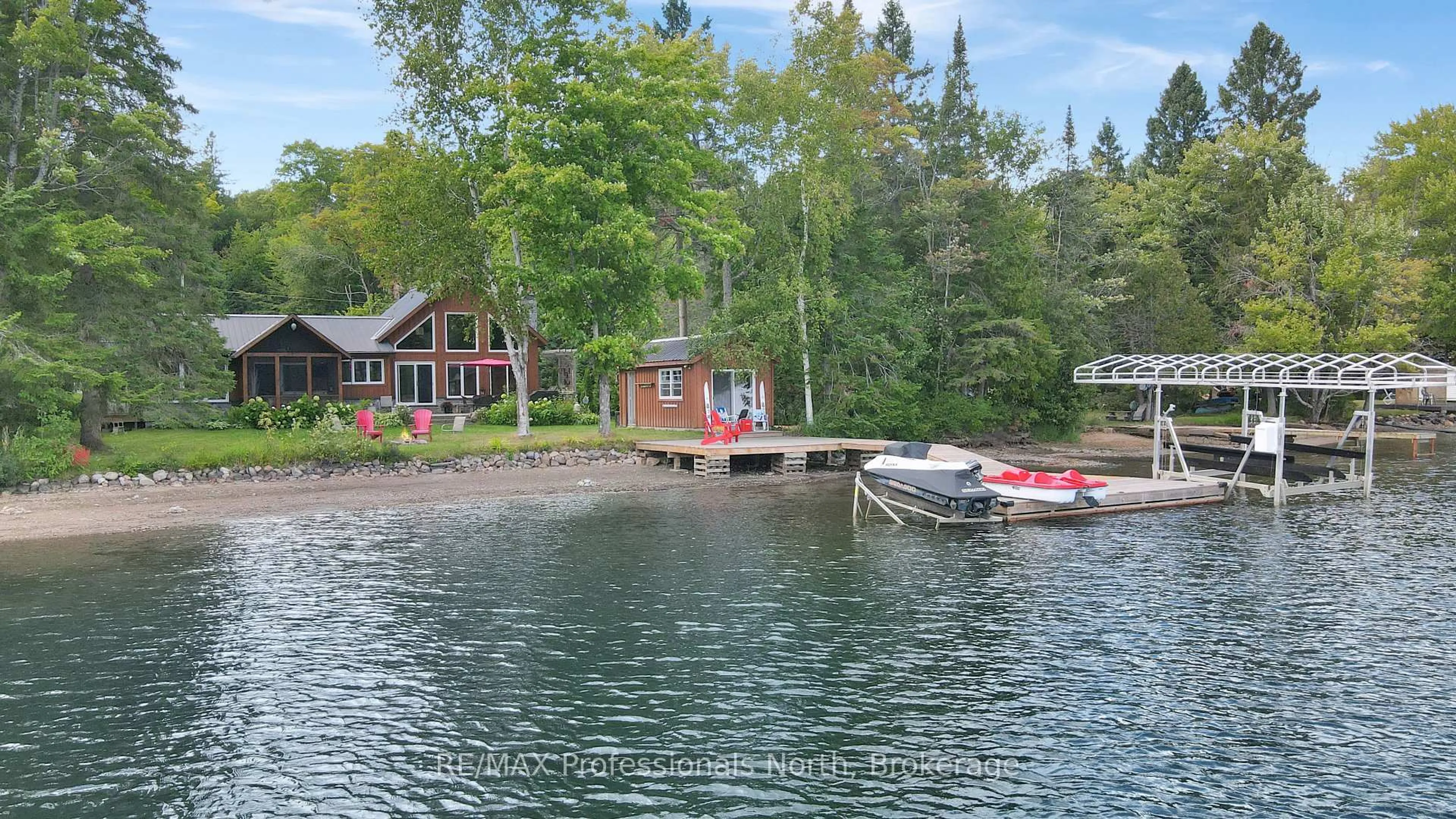 A pic from outside/outdoor area/front of a property/back of a property/a pic from drone, water/lake/river/ocean view for 1342 Twelve Mile Lake Rd, Minden Hills Ontario K0M 2K0