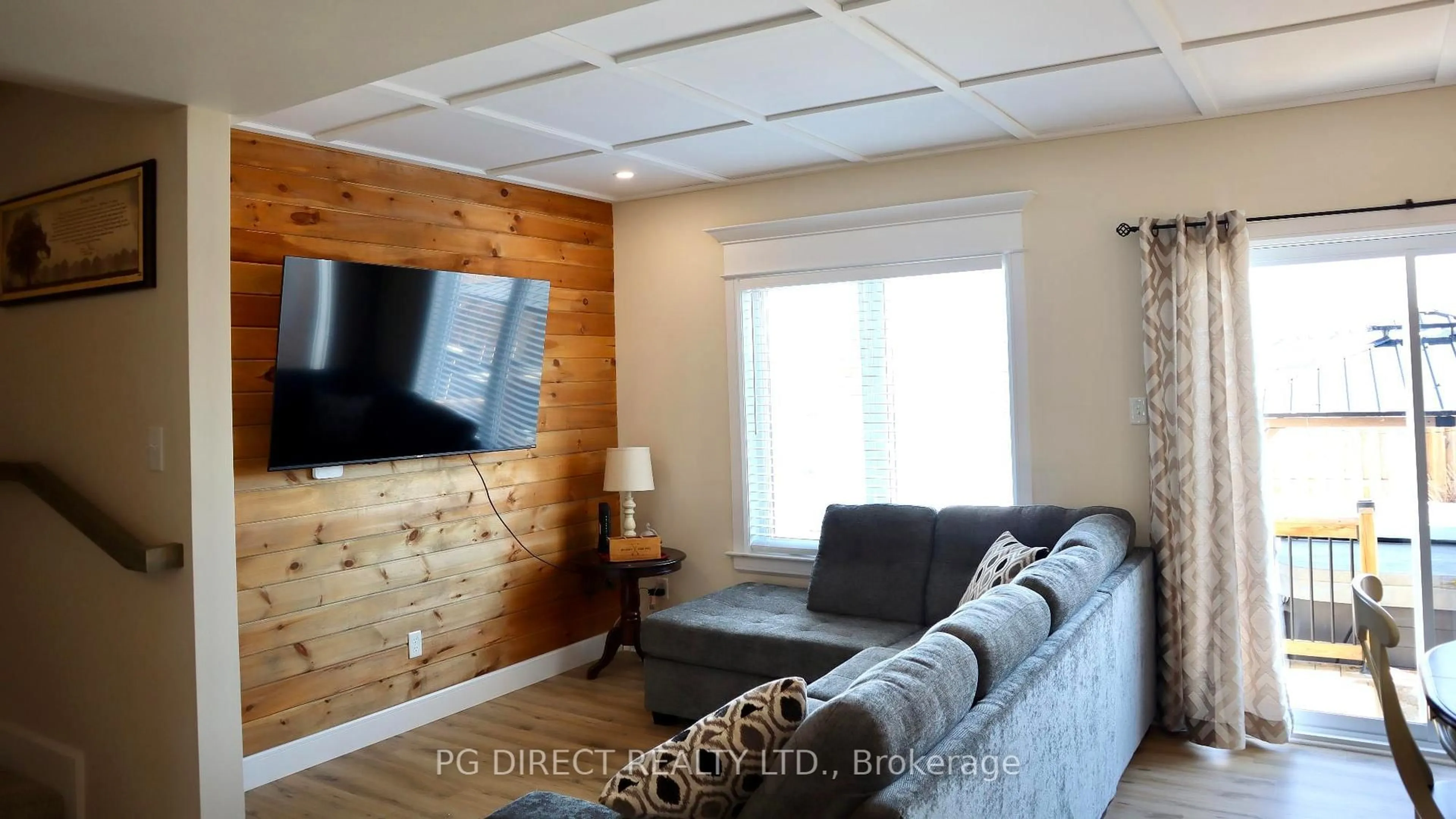 Living room with furniture, wood/laminate floor for 55 Chad St, Petawawa Ontario K8H 0G9