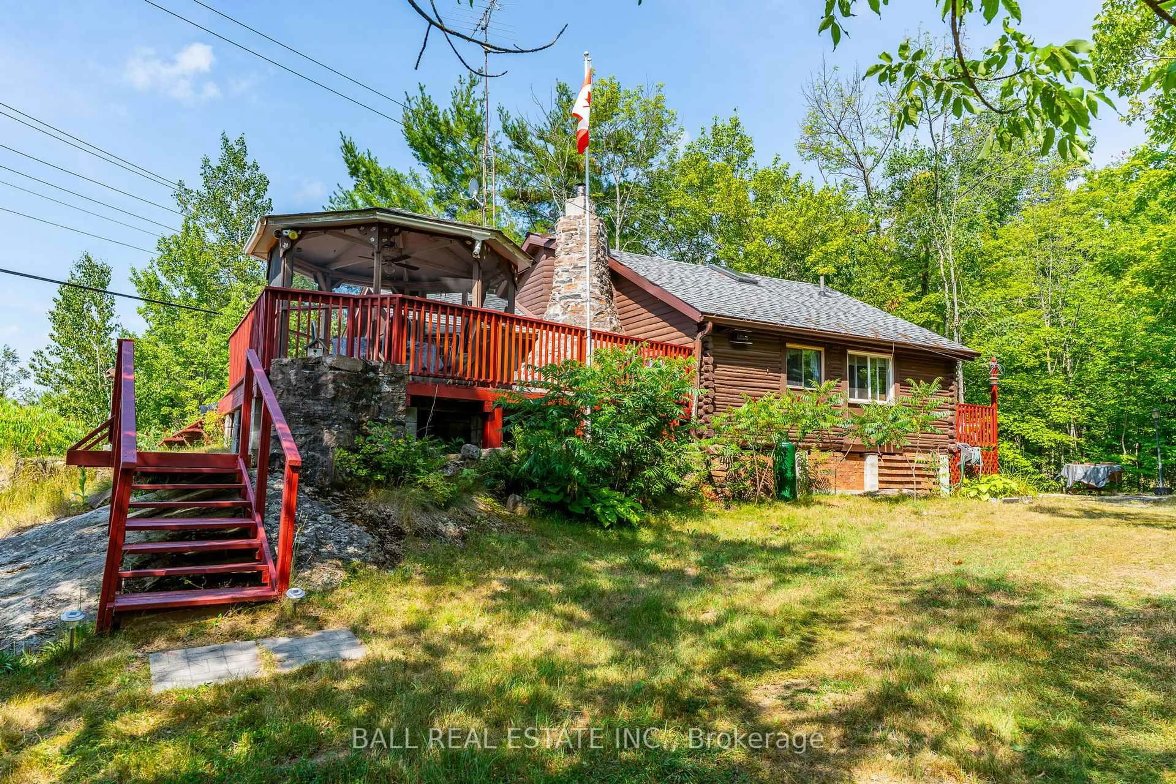 A pic from outside/outdoor area/front of a property/back of a property/a pic from drone, water/lake/river/ocean view for 1017 Ewles Dr, Minden Hills Ontario K0M 2L1