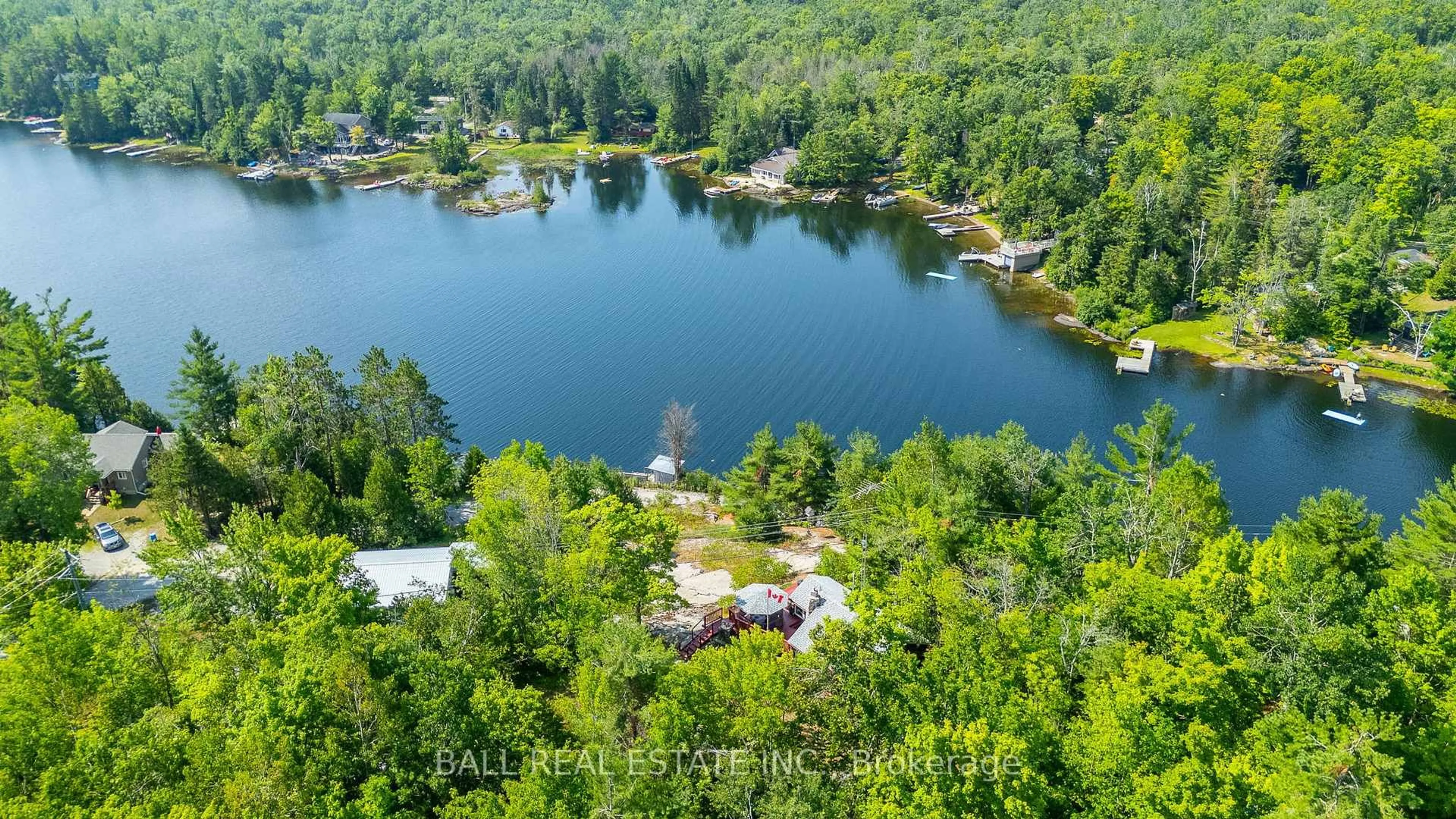 A pic from outside/outdoor area/front of a property/back of a property/a pic from drone, water/lake/river/ocean view for 1017 Ewles Dr, Minden Hills Ontario K0M 2L1