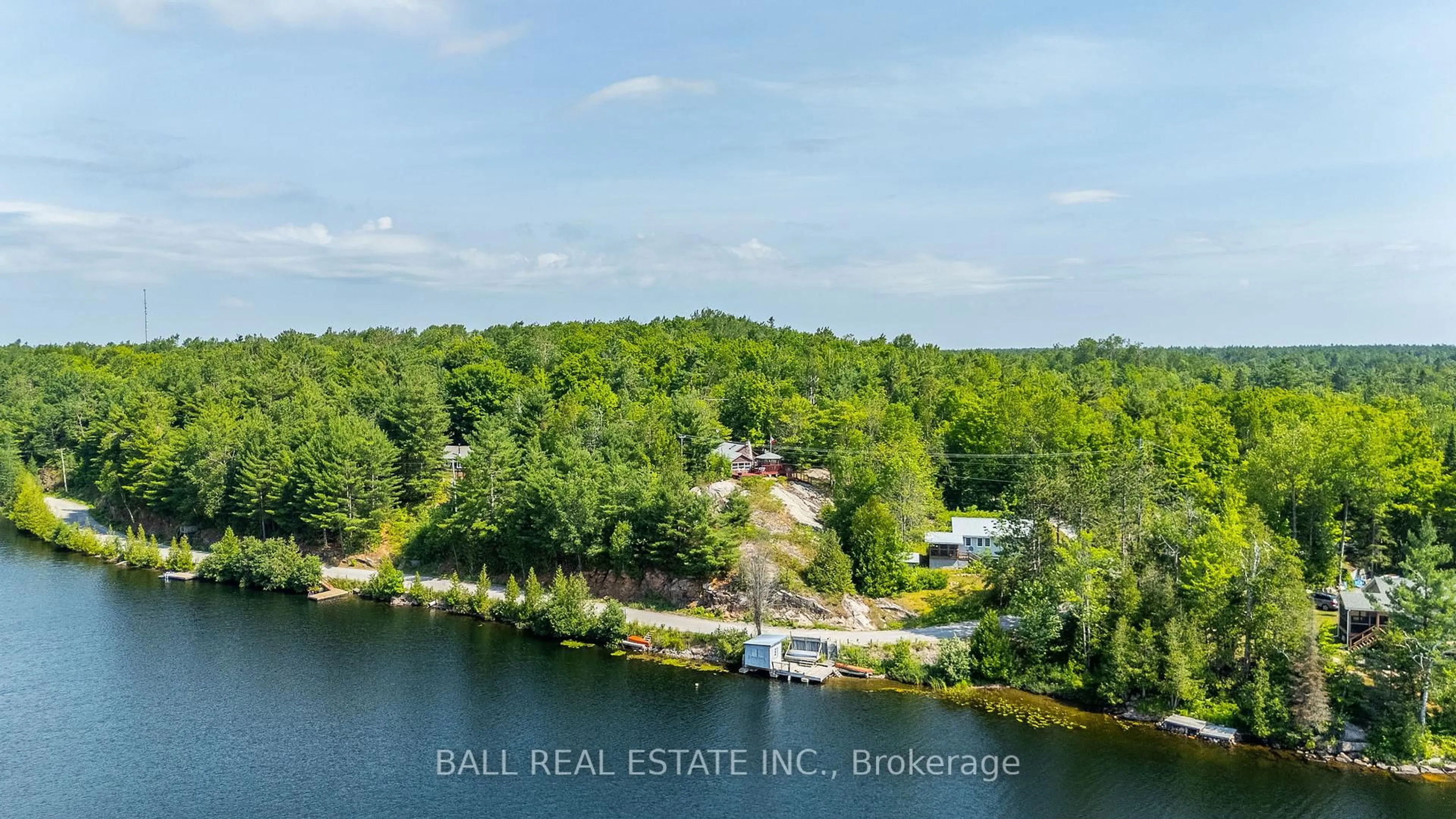 A pic from outside/outdoor area/front of a property/back of a property/a pic from drone, water/lake/river/ocean view for 1017 Ewles Dr, Minden Hills Ontario K0M 2L1