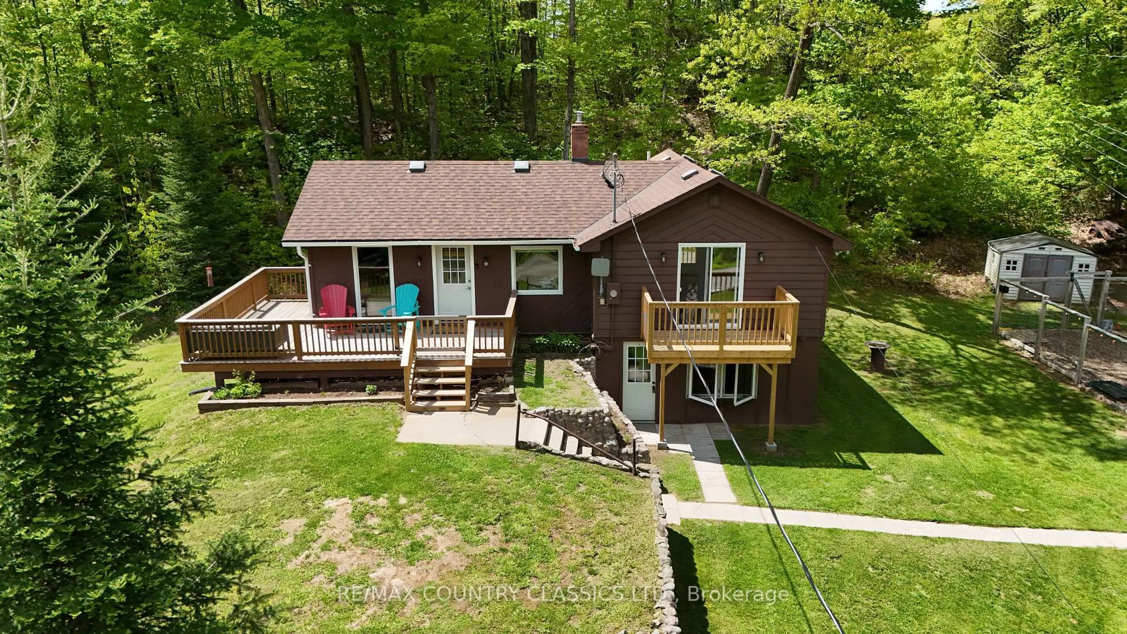 A pic from outside/outdoor area/front of a property/back of a property/a pic from drone, water/lake/river/ocean view for 164 Trout Lake Rd, Bancroft Ontario K0L 1C0