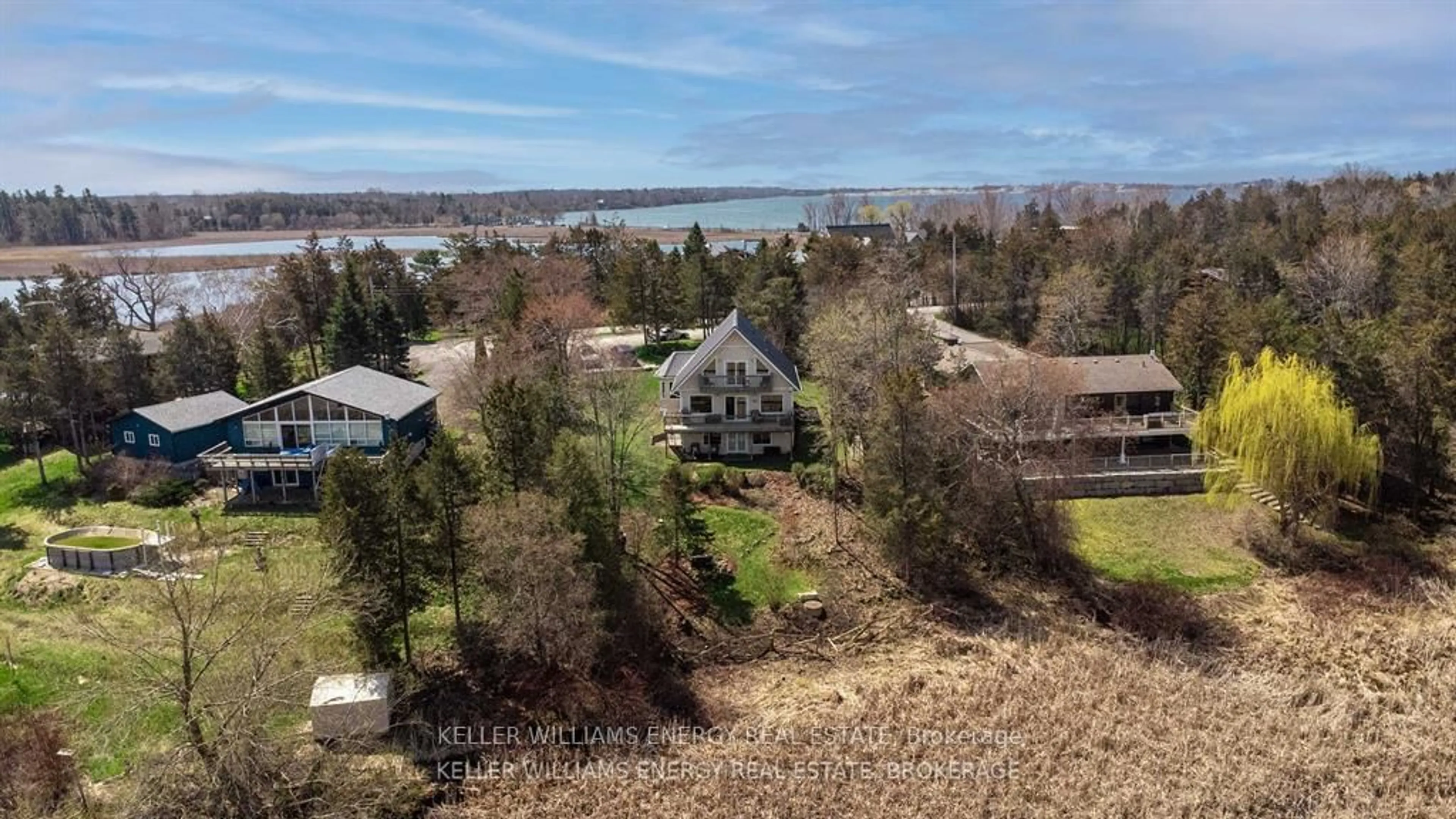 A pic from outside/outdoor area/front of a property/back of a property/a pic from drone, water/lake/river/ocean view for 96 Island Rd, Prince Edward County Ontario K0K 2T0