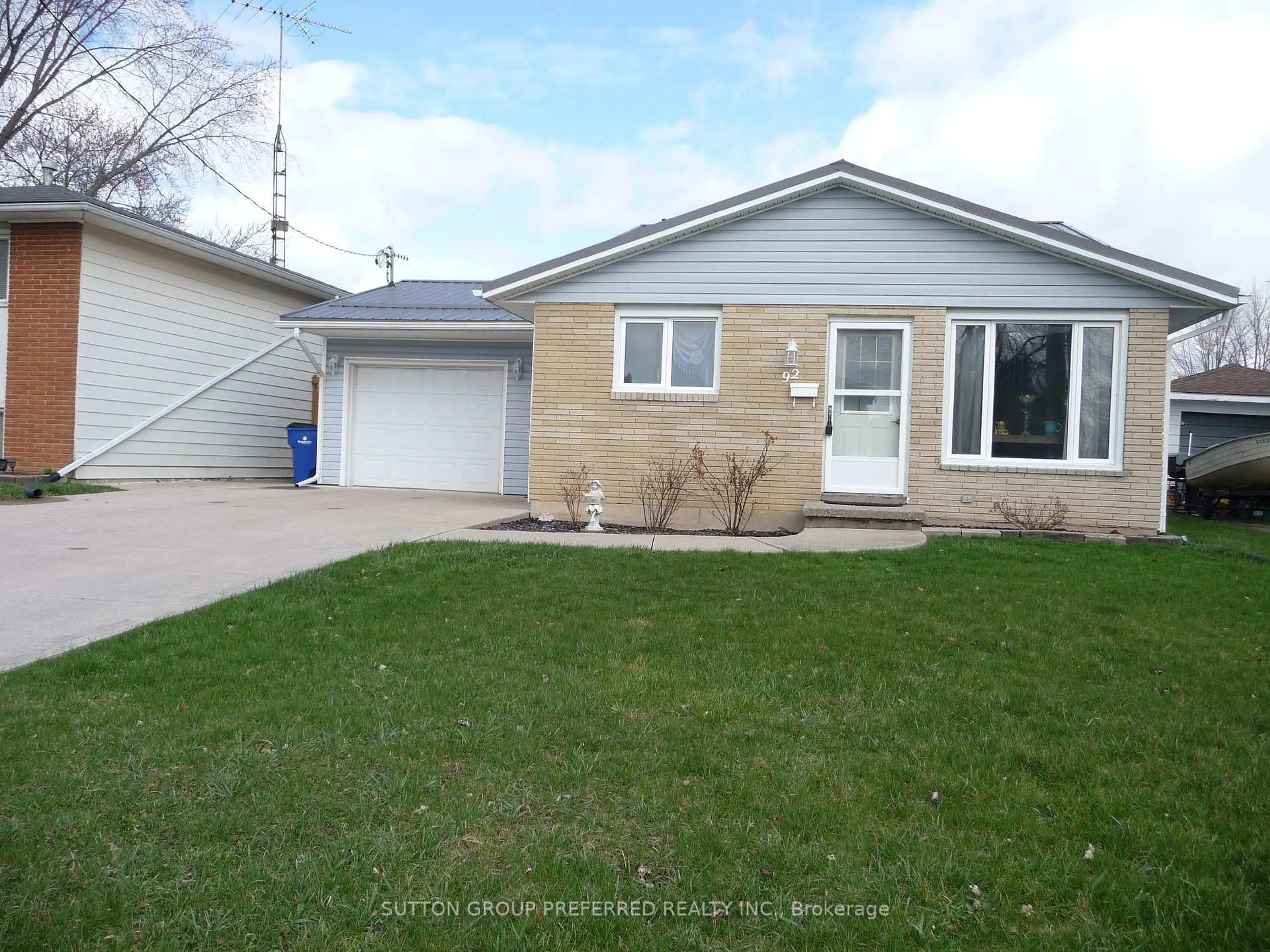 Home with vinyl exterior material, street for 92 Earl St, Chatham-Kent Ontario N8A 1C7