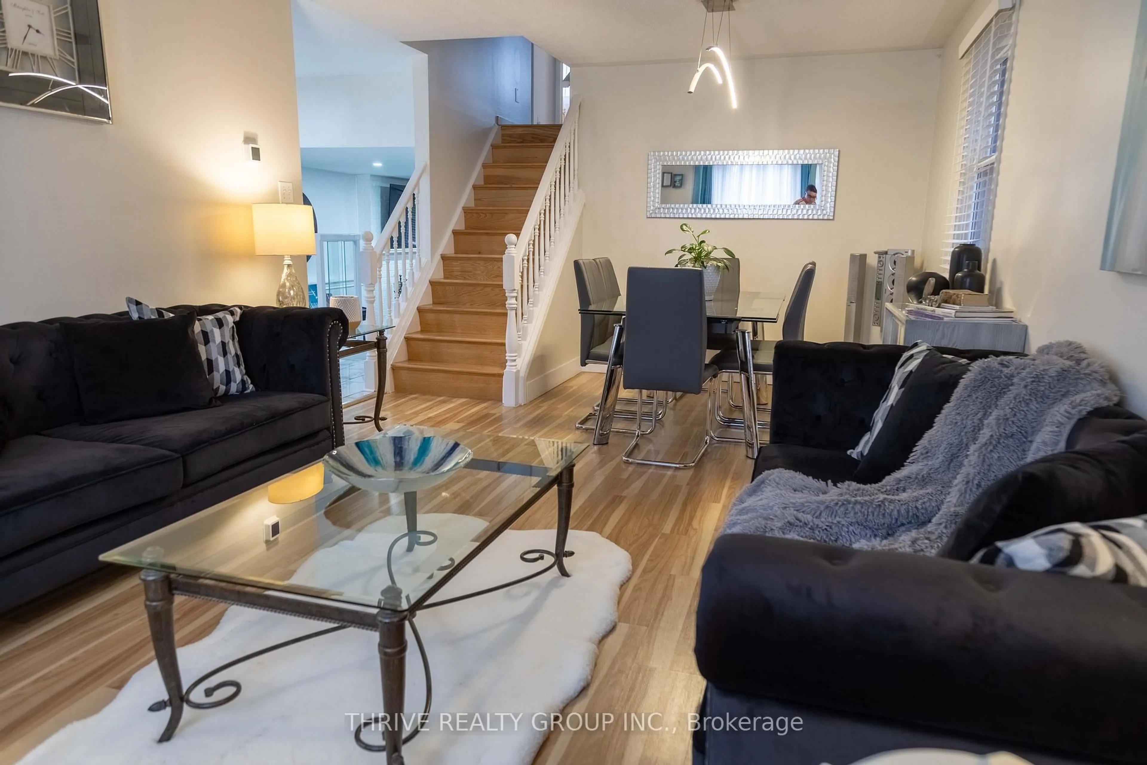 Living room with furniture, wood/laminate floor for 180 Clara Cres, London South Ontario N6E 3H2