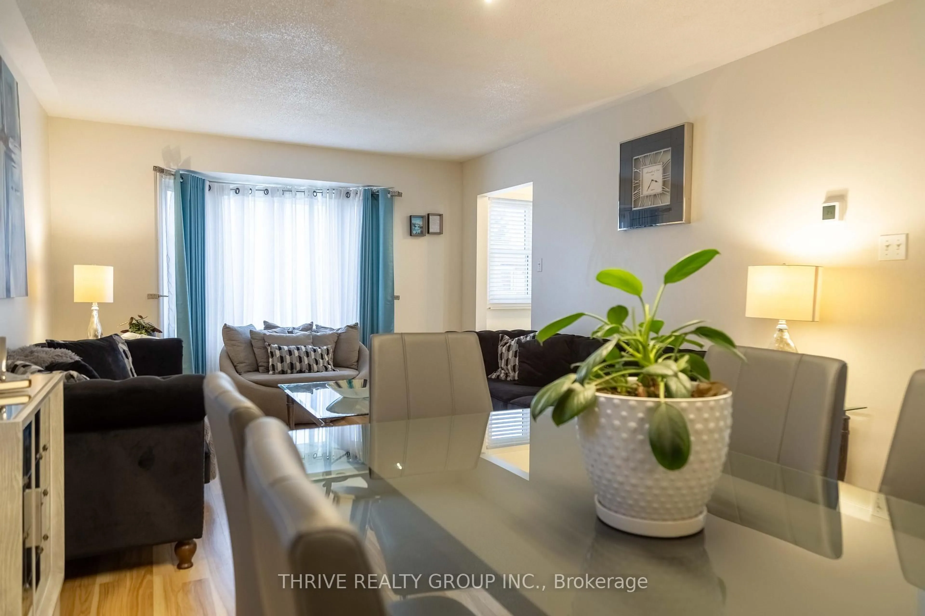 Living room with furniture, wood/laminate floor for 180 Clara Cres, London South Ontario N6E 3H2