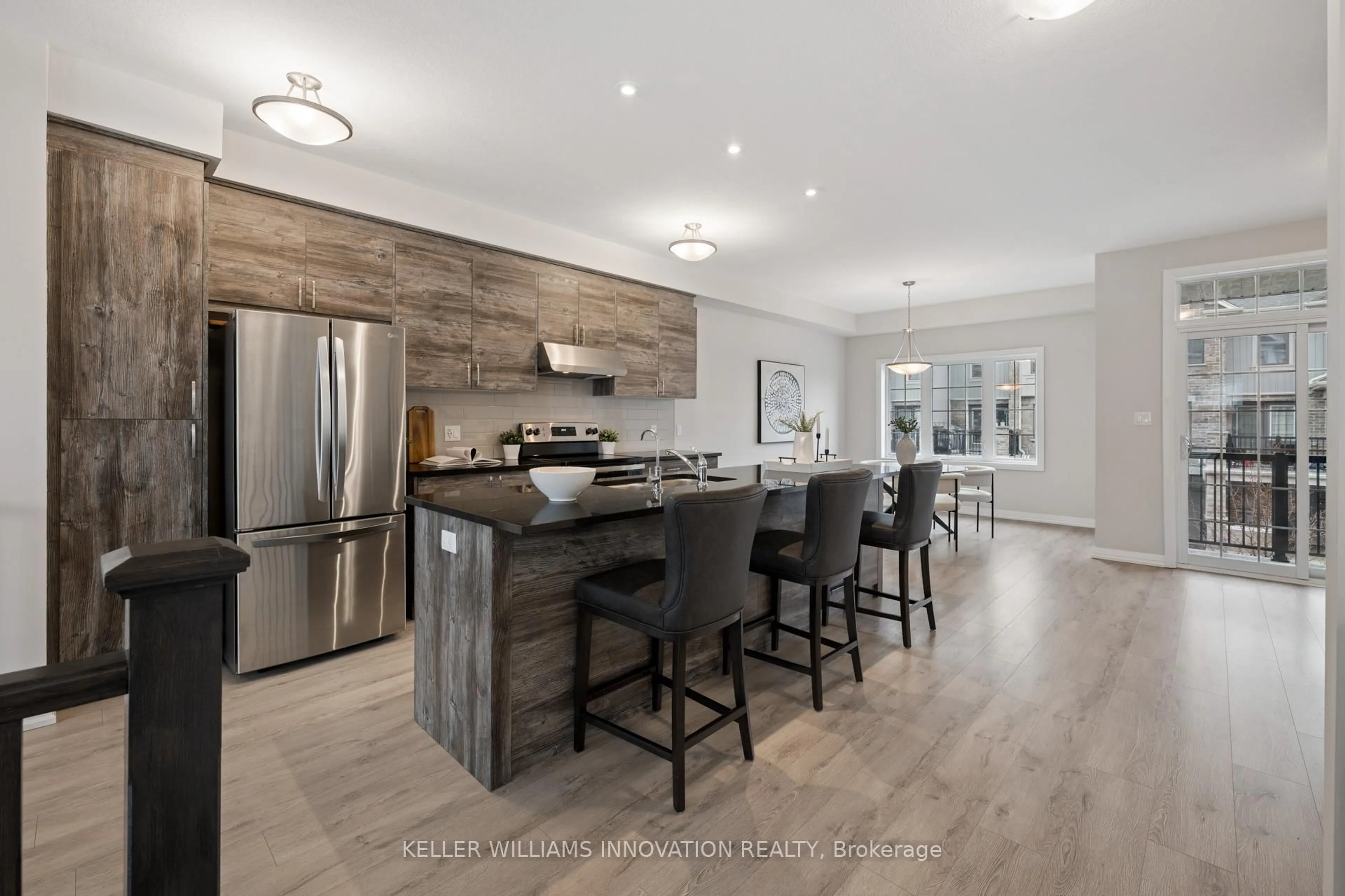 Open concept kitchen, wood/laminate floor for 54 Bank Swallow Cres, Kitchener Ontario N2P 0J7