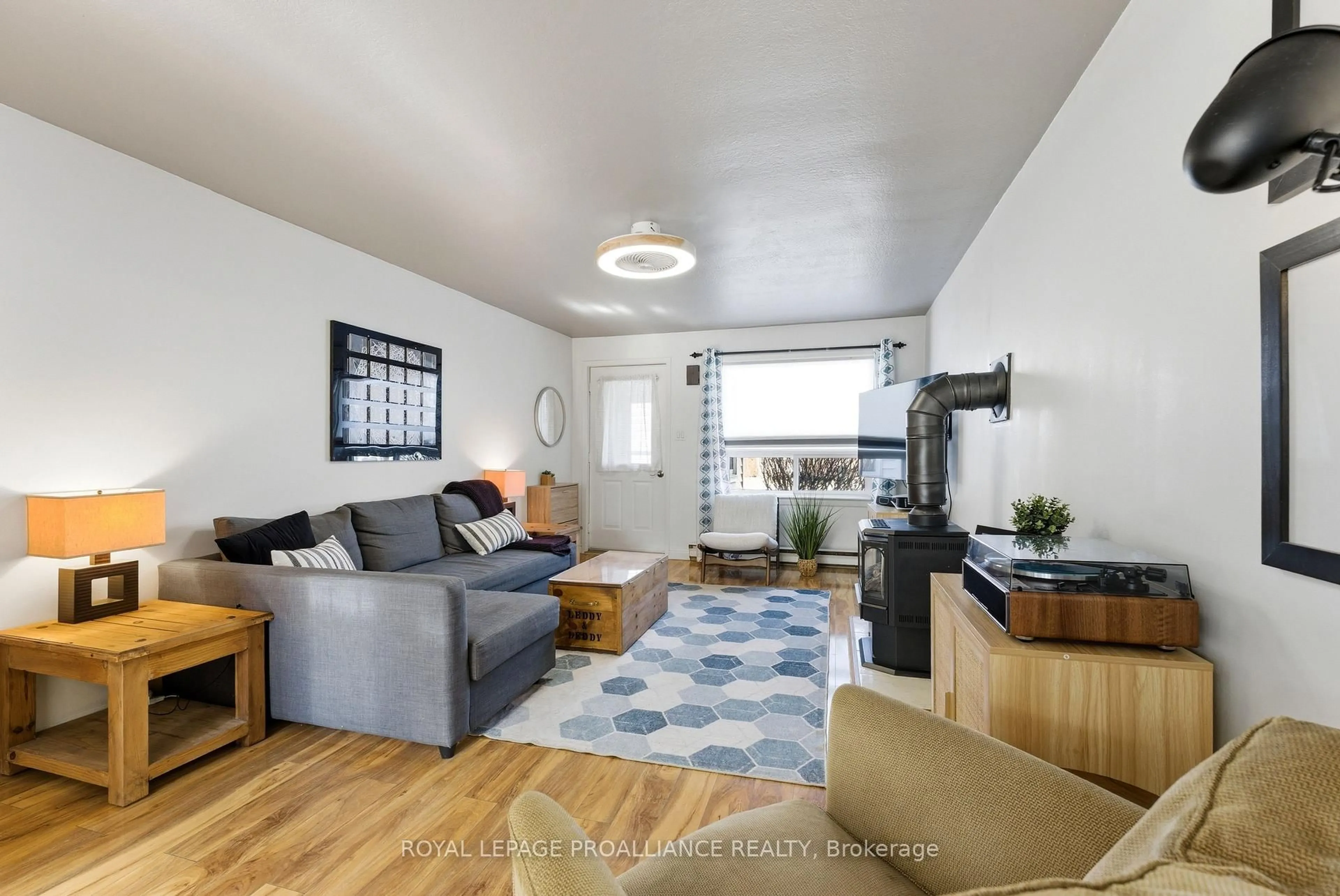 Living room with furniture, wood/laminate floor for 23 Guelph St, Quinte West Ontario K8V 4G2