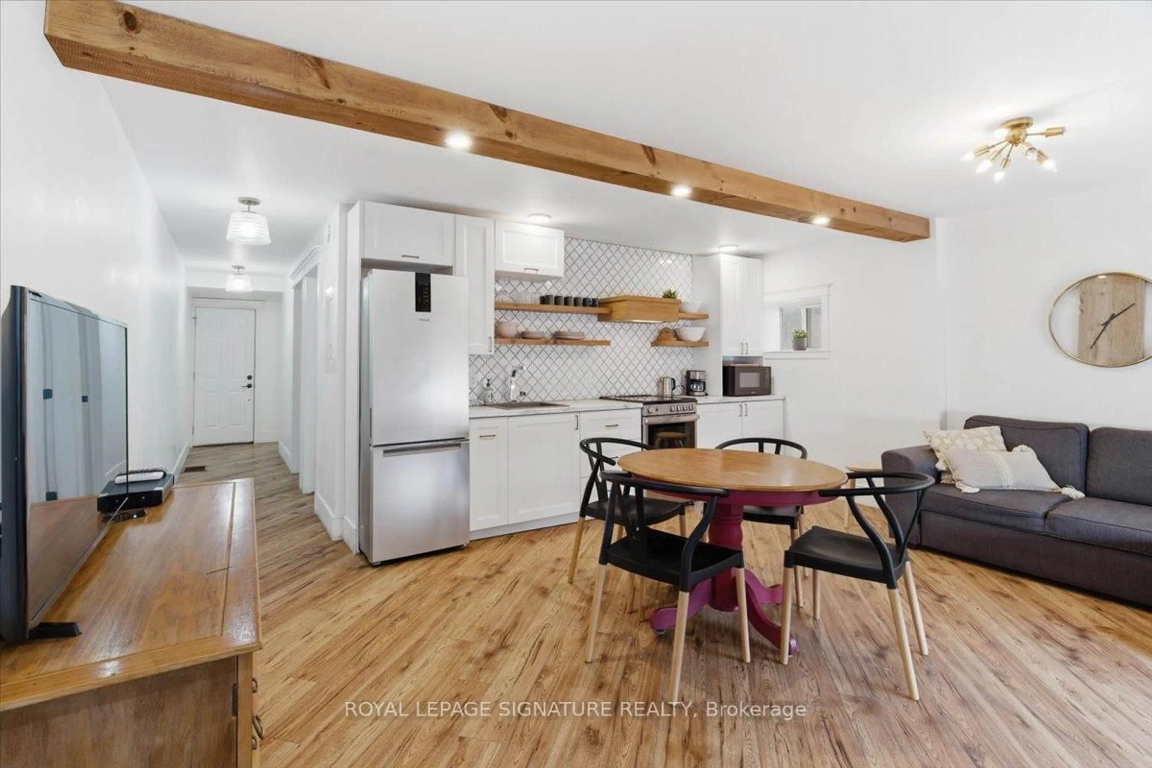 Open concept kitchen, wood/laminate floor for 52 PICTON MAIN St, Prince Edward County Ontario K0K 2T0