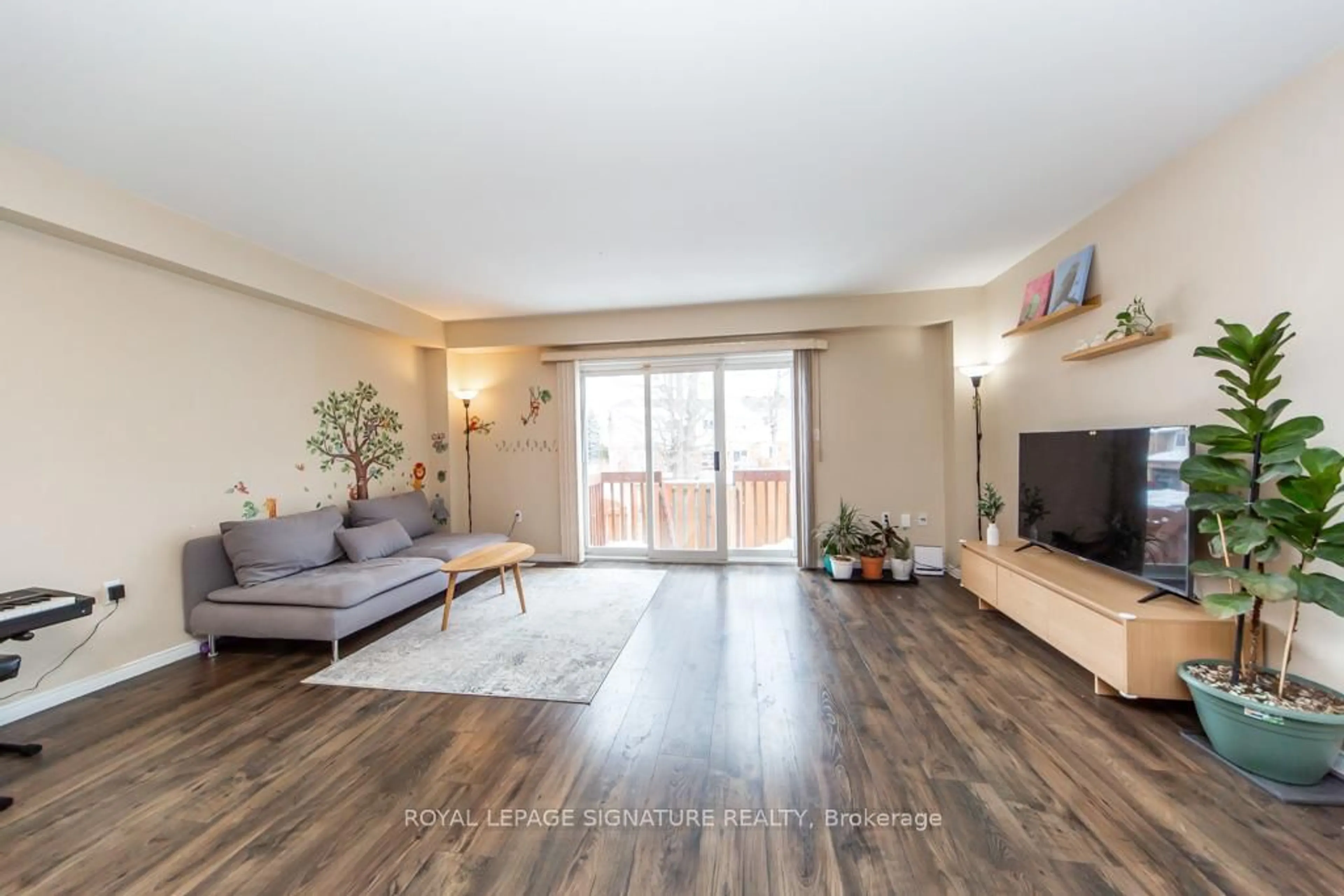Living room with furniture, wood/laminate floor for 346 Highland Rd #34, Hamilton Ontario L8J 3T3