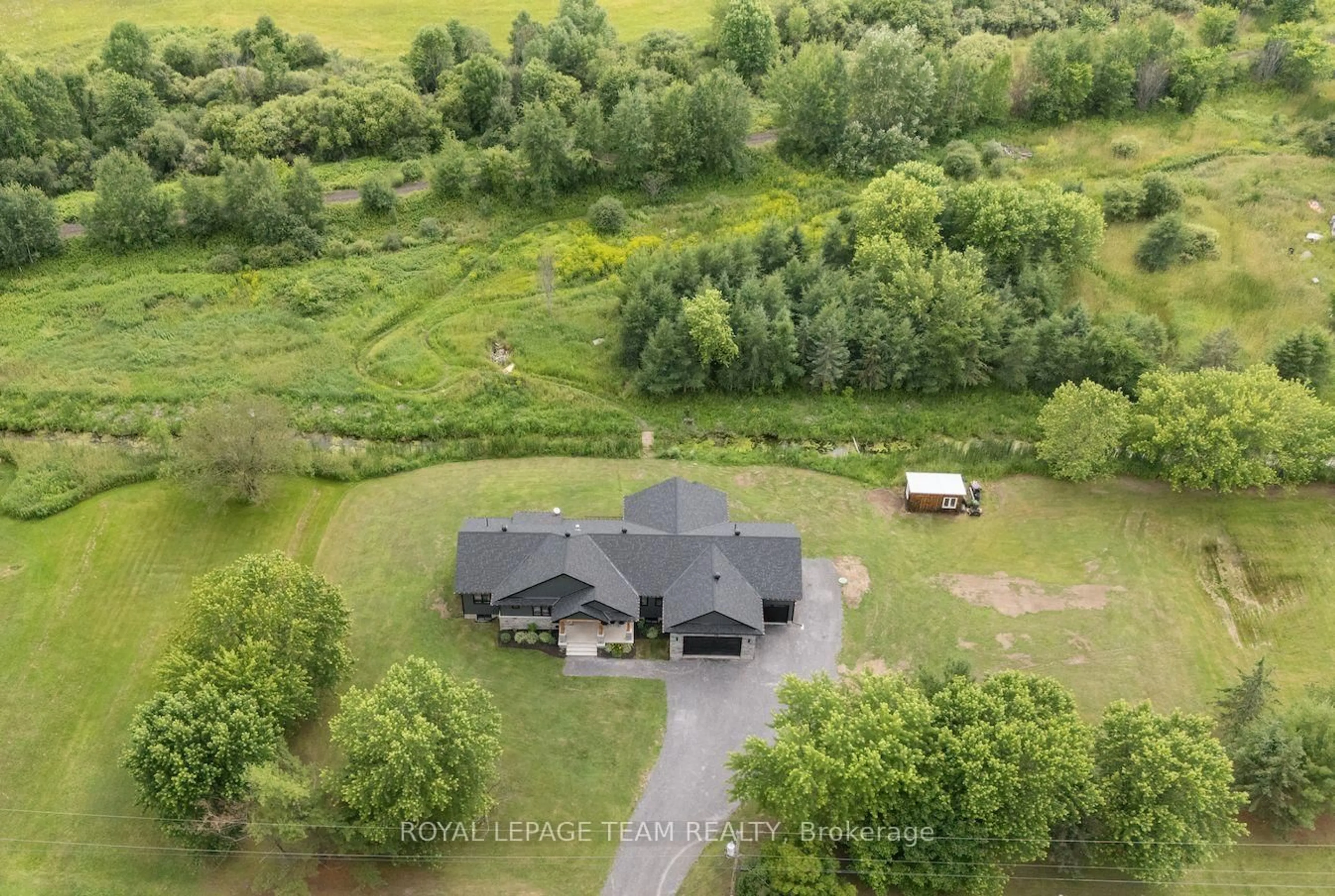 A pic from outside/outdoor area/front of a property/back of a property/a pic from drone, unknown for 3783 Woodkilton Rd, Ottawa Ontario K0A 3M0