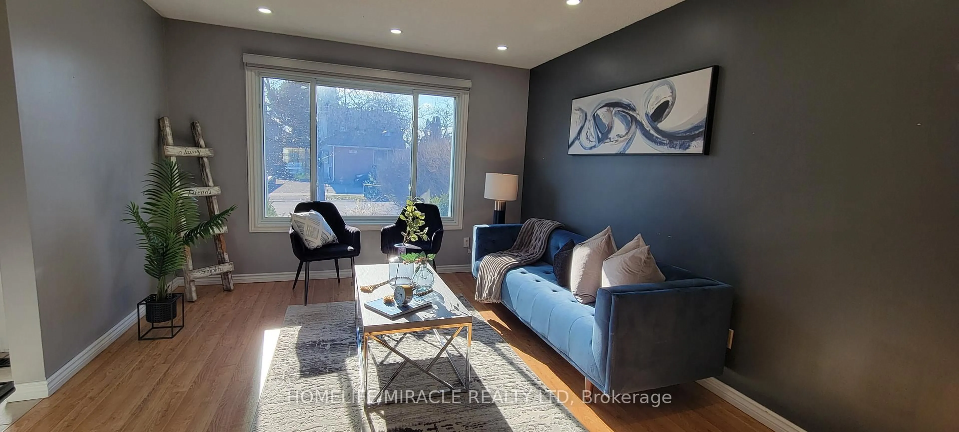 Living room with furniture, wood/laminate floor for 567 Ferndale Crt, London South Ontario N6C 5C2