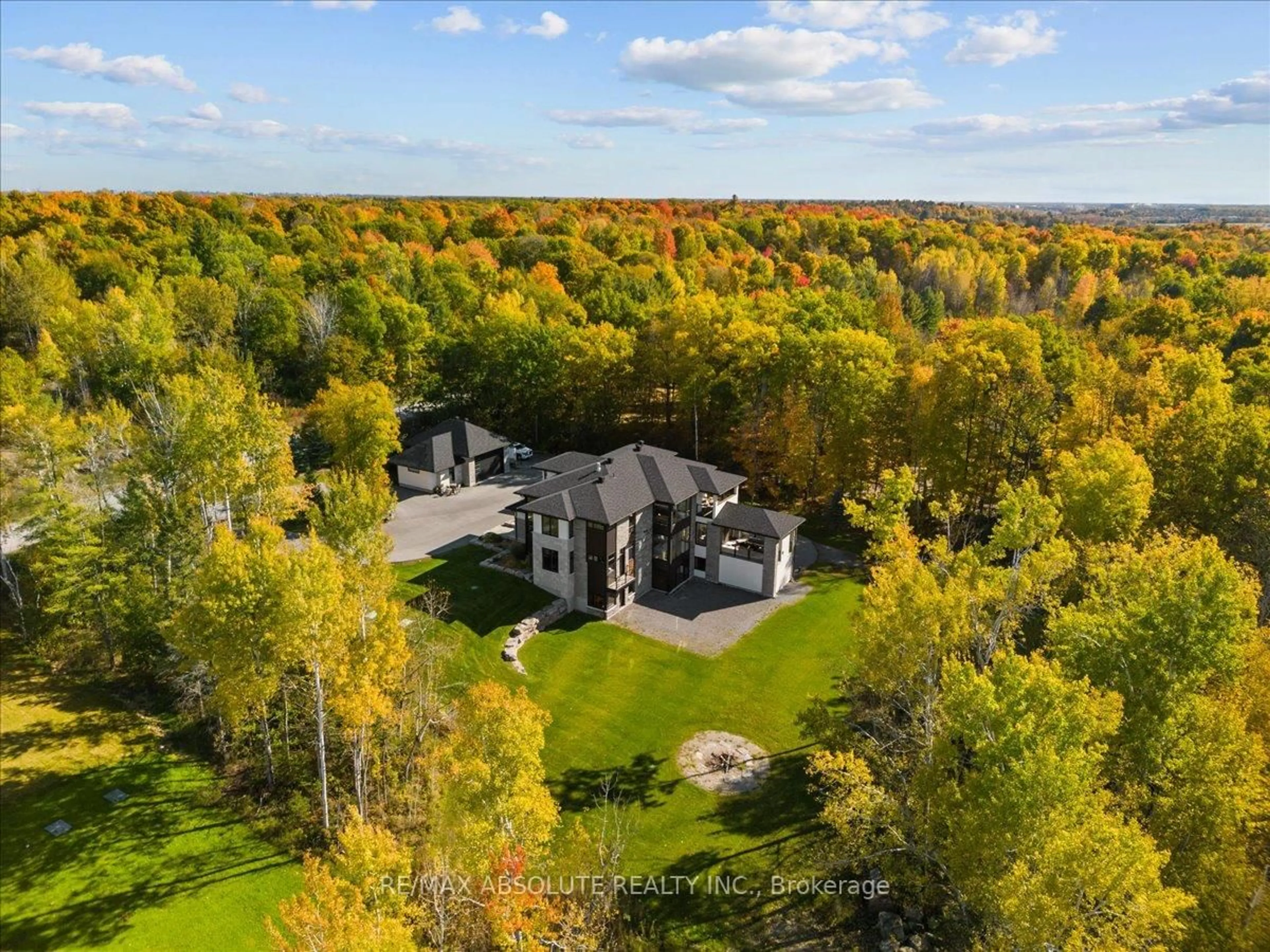 A pic from outside/outdoor area/front of a property/back of a property/a pic from drone, forest/trees view for 131 Cherryhill Dr, Carp Ontario K0A 1L0