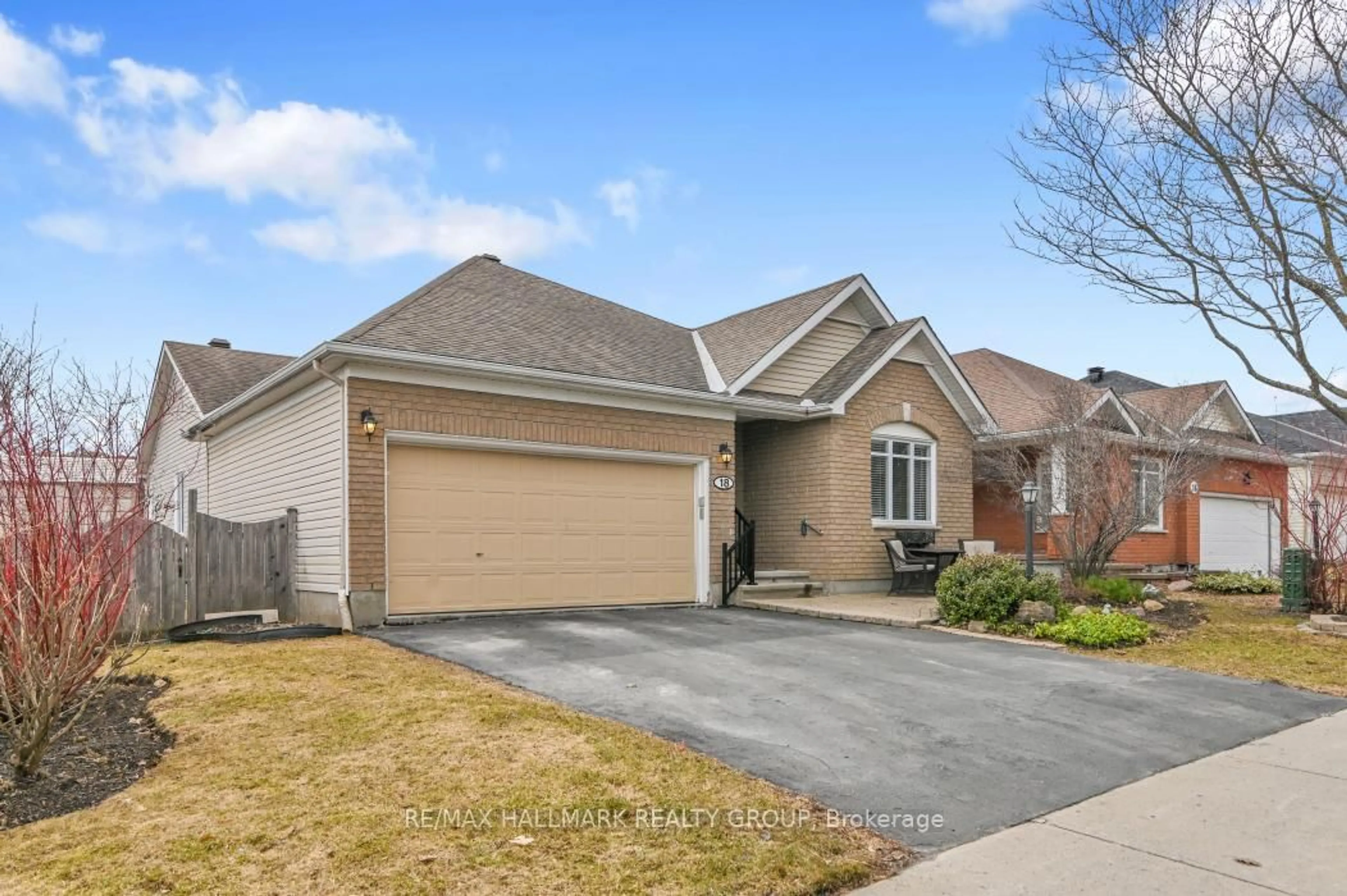 Home with brick exterior material, street for 18 Spinney Way, Ottawa Ontario K2J 4Y8