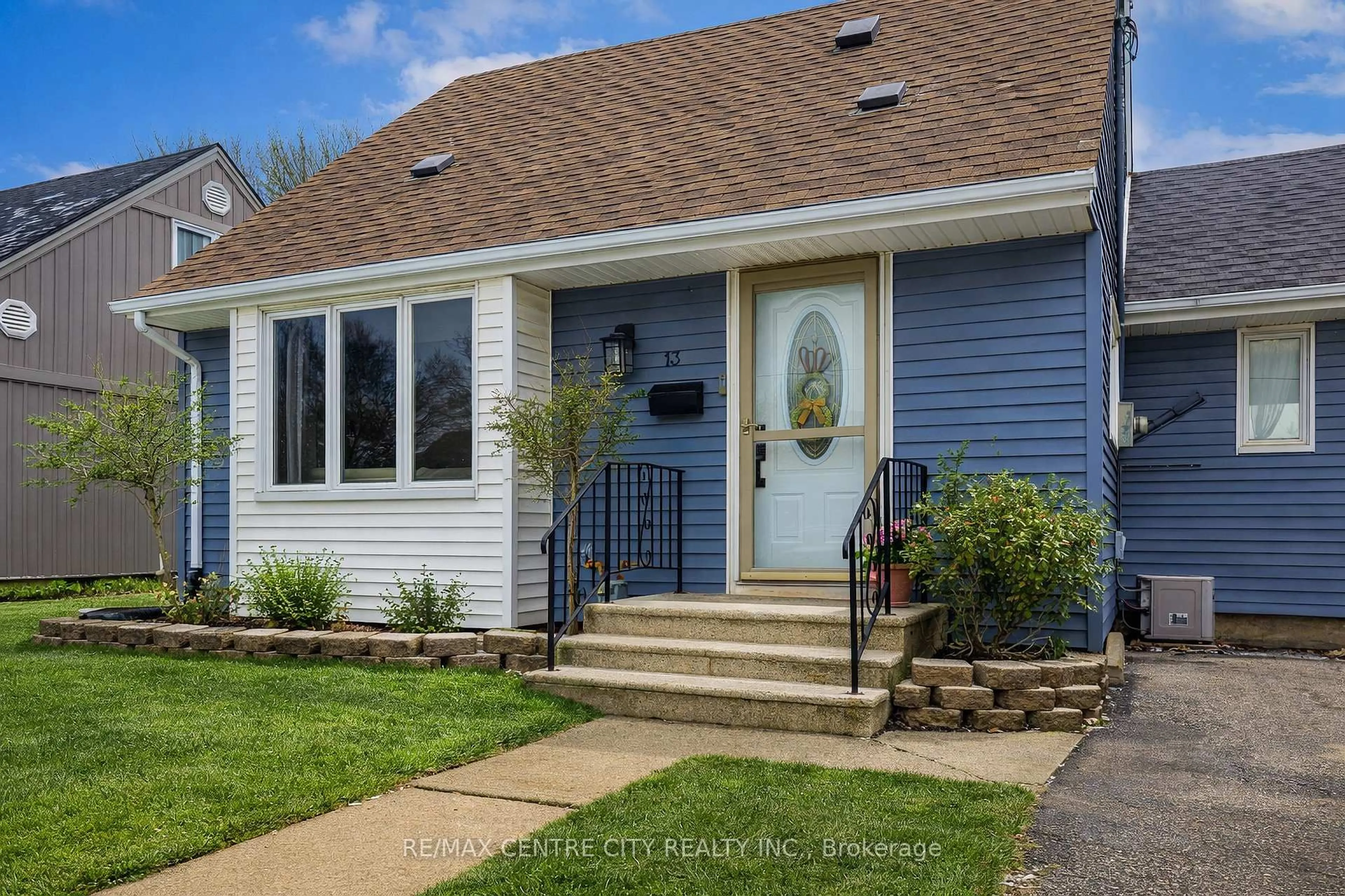 Home with vinyl exterior material, street for 13 Bell Ave, St. Thomas Ontario N5R 1G4