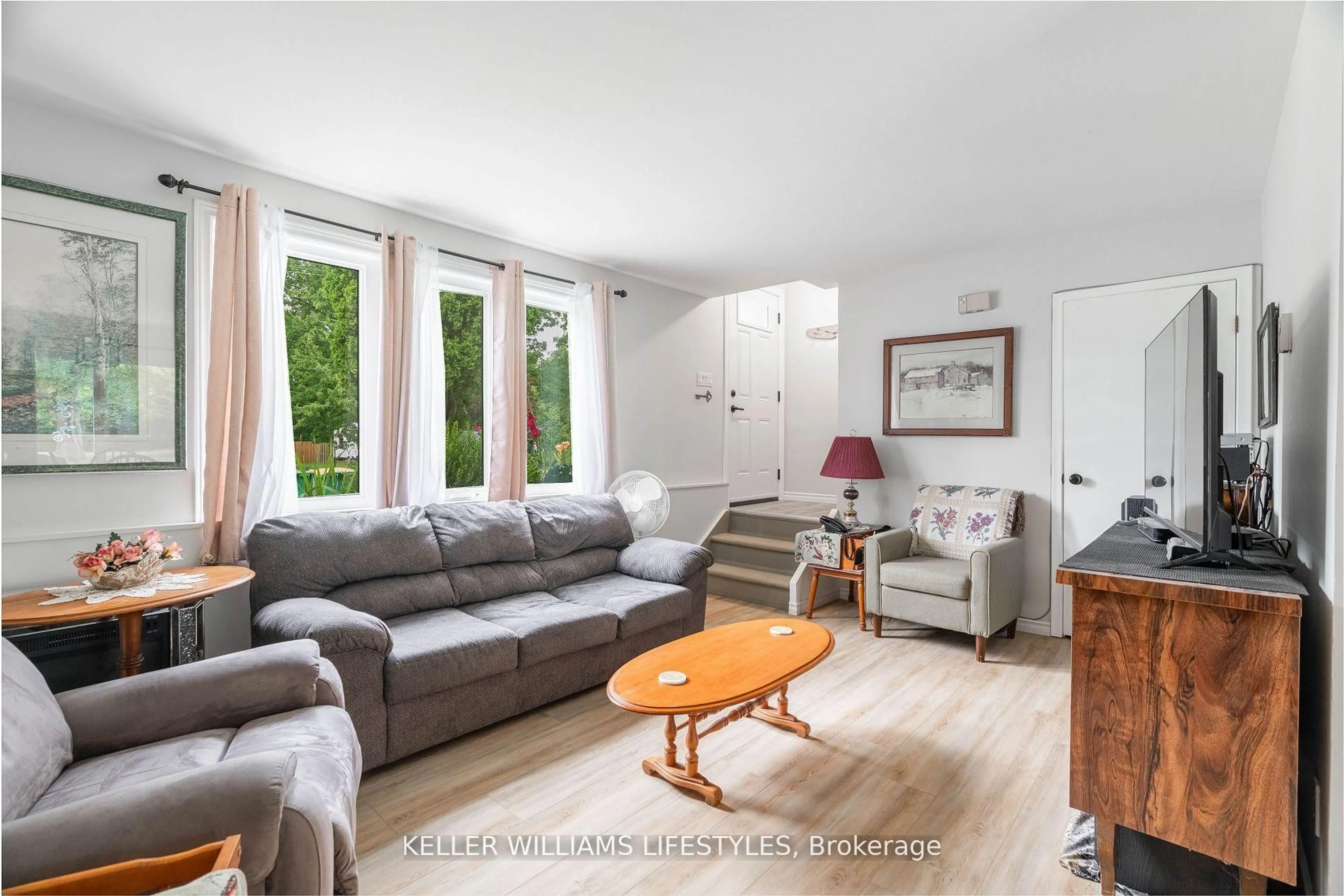 Living room with furniture, wood/laminate floor for 155 Water St #2, Southwest Middlesex Ontario N0L 1M0