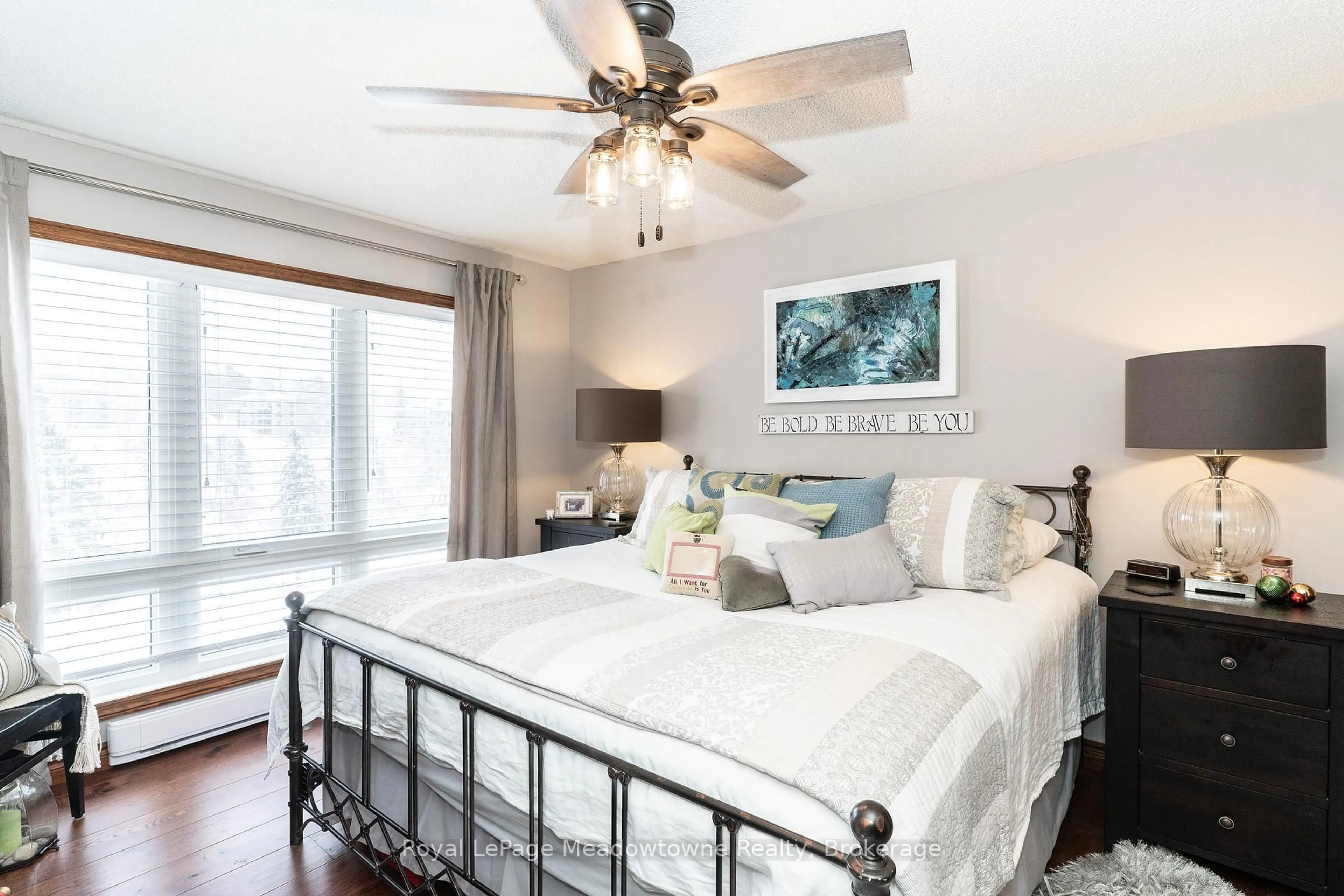 Bedroom with bed, wood/laminate floor for 34 Deerhurst Greens Rd #301, Huntsville Ontario P1H 1A9